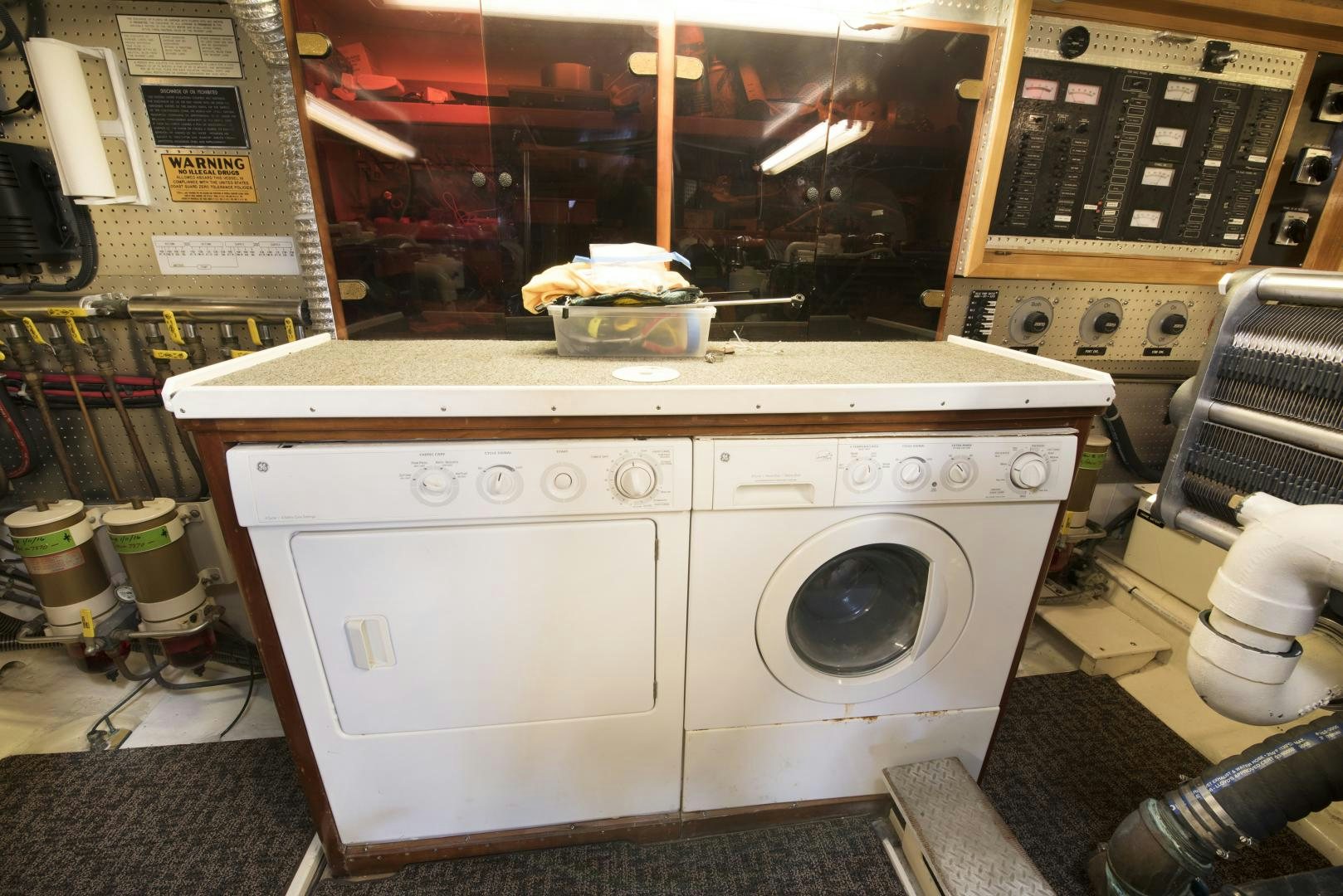 a washing machine in a room aboard LEGACY Yacht for Sale