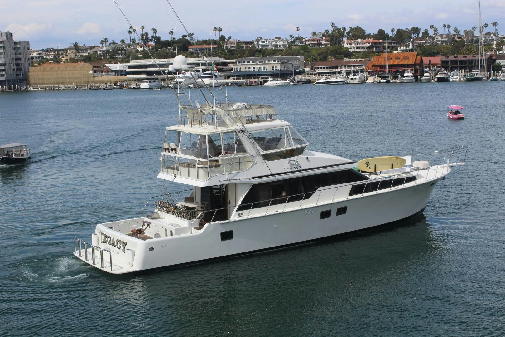 a large white boat in the water aboard LEGACY Yacht for Sale
