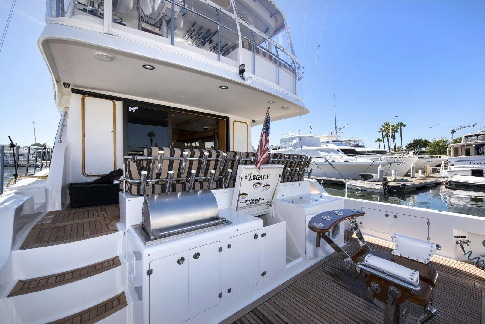 a boat docked at a pier aboard LEGACY Yacht for Sale