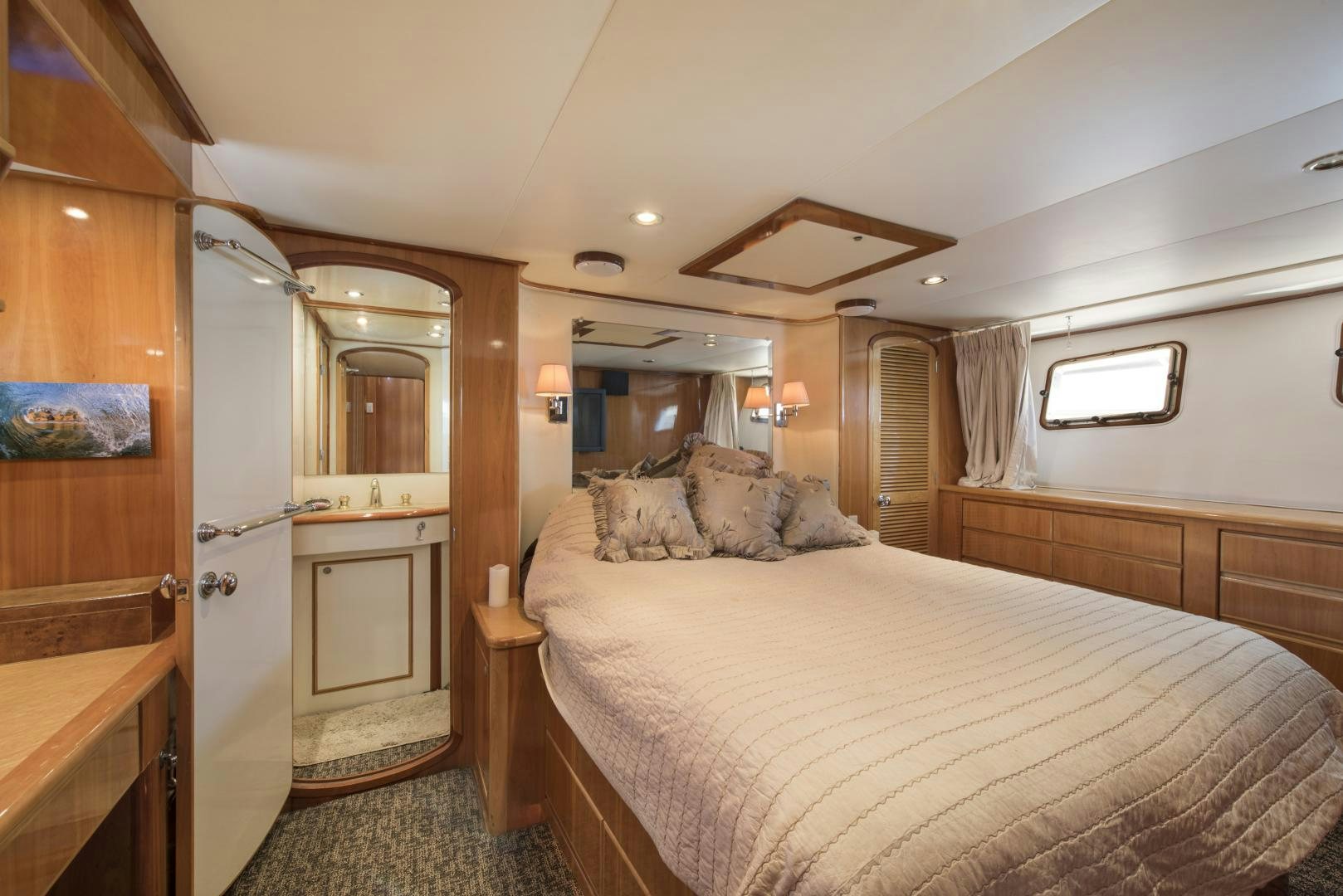 a bedroom with a large bed aboard LEGACY Yacht for Sale
