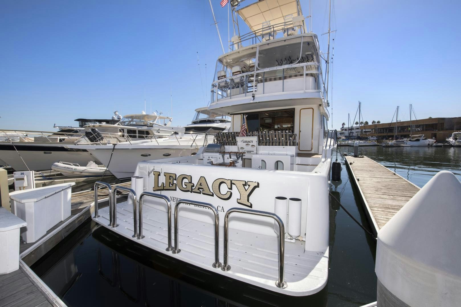 a large white boat docked aboard LEGACY Yacht for Sale