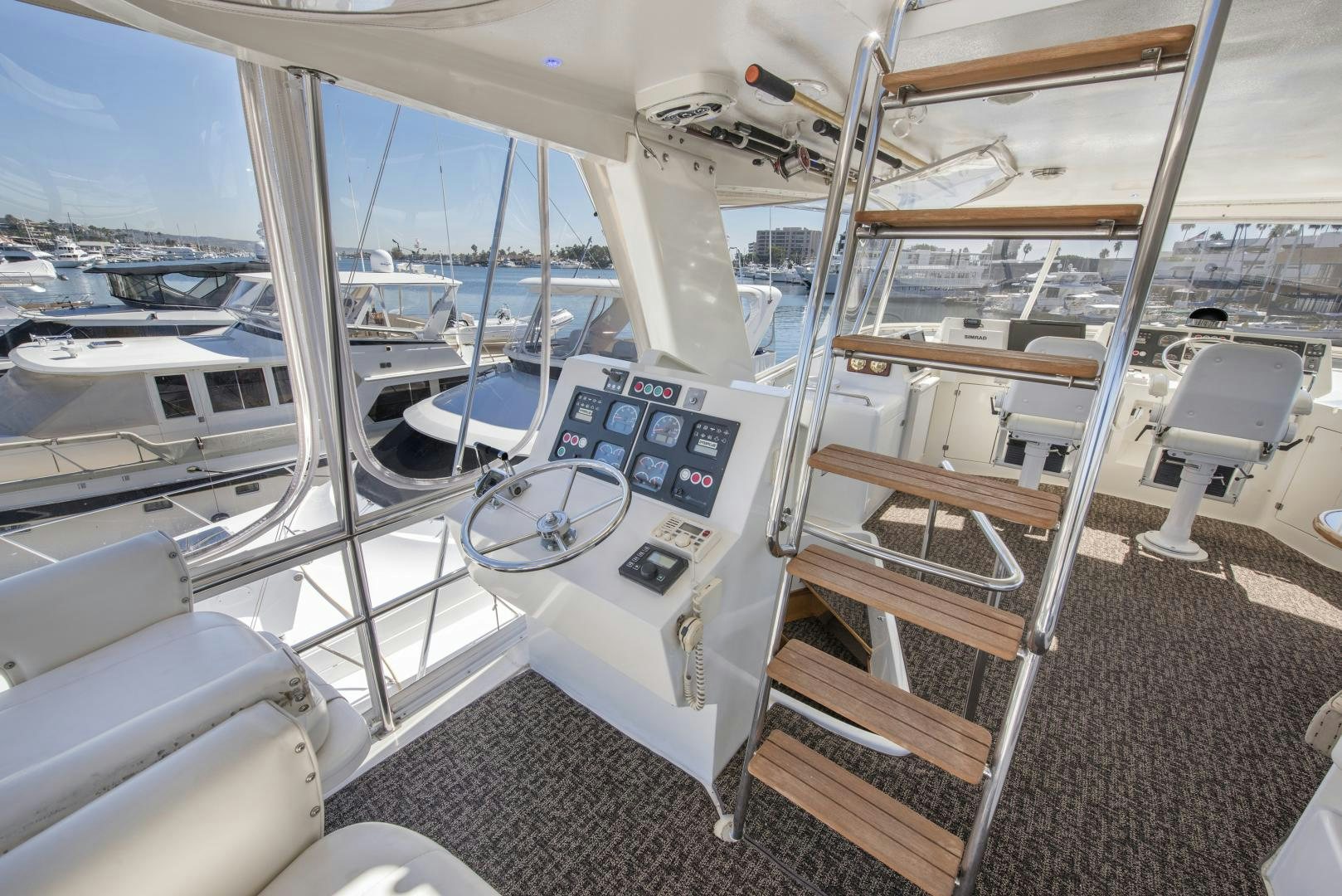 a boat with a desk and chairs aboard LEGACY Yacht for Sale