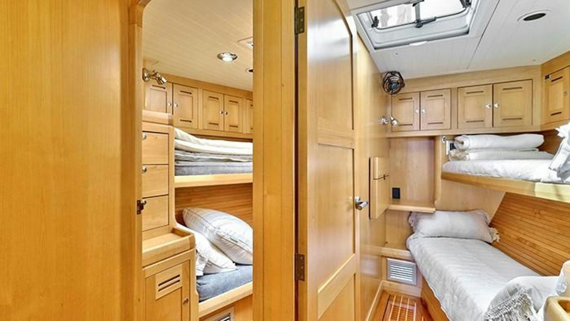 a room with bunk beds aboard MAYA Yacht for Sale