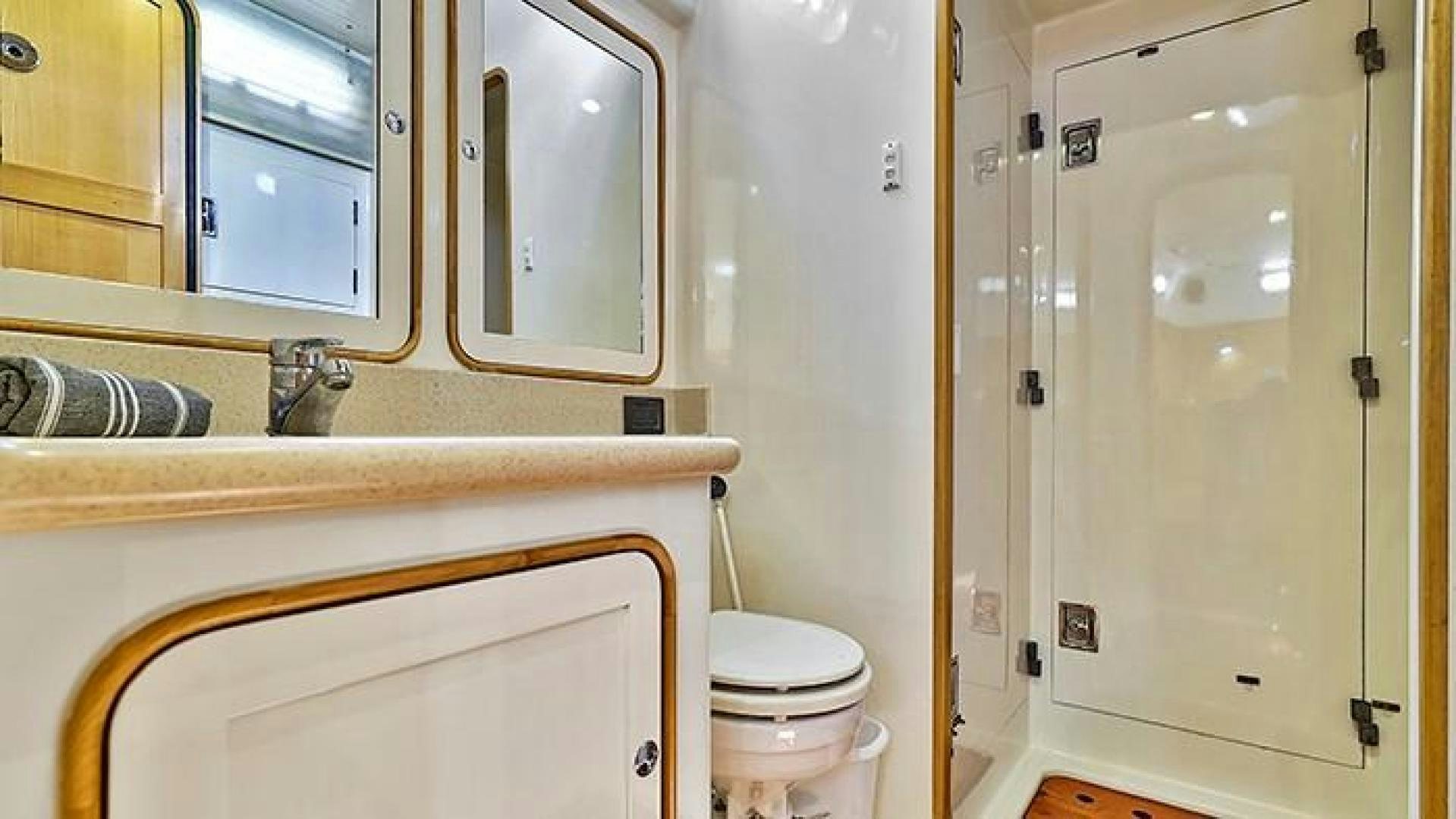 a bathroom with a toilet and a sink aboard MAYA Yacht for Sale