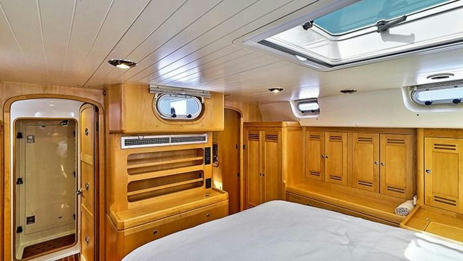 a room with wooden cabinets aboard MAYA Yacht for Sale