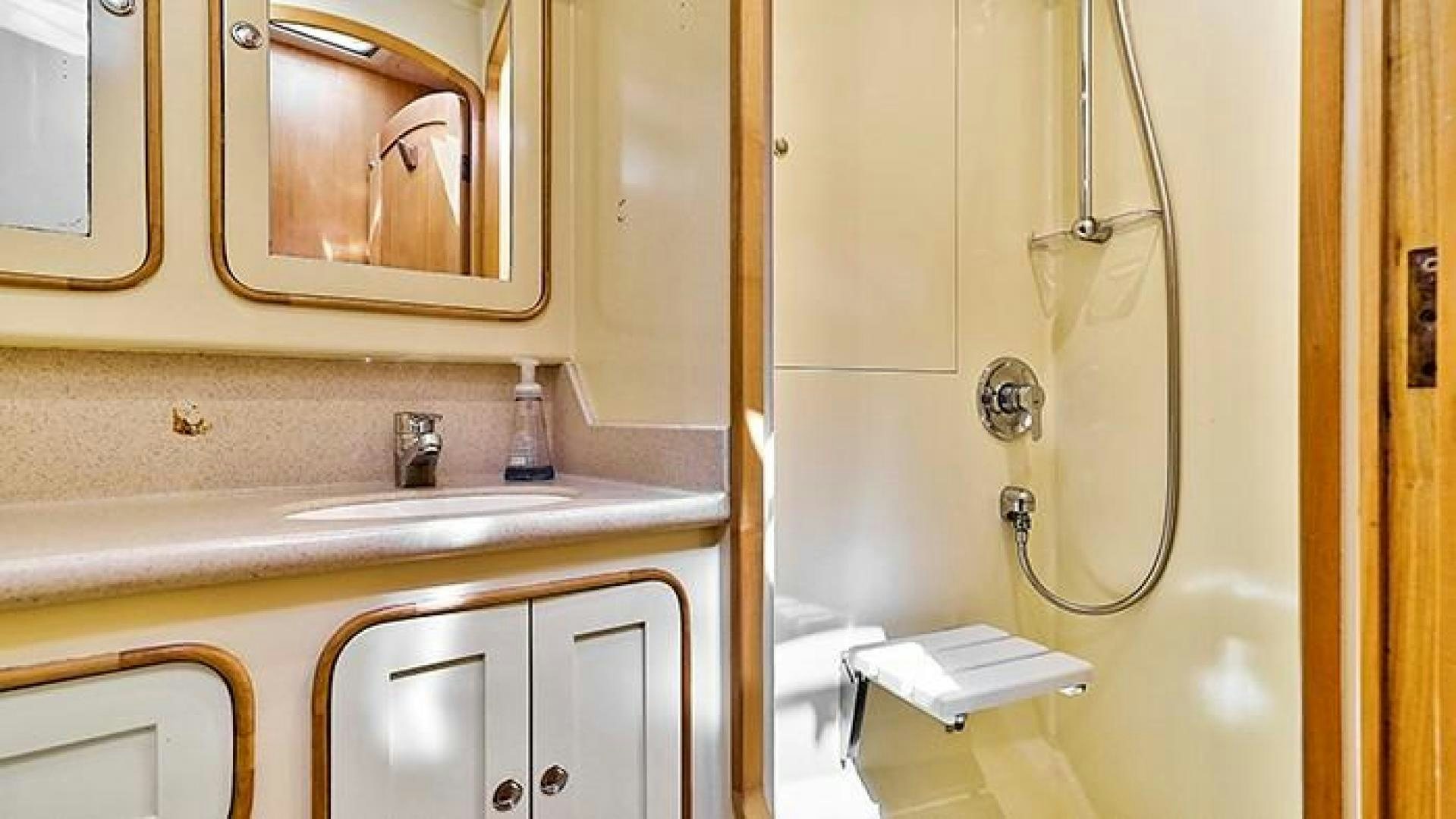 a bathroom with a sink and a mirror aboard MAYA Yacht for Sale