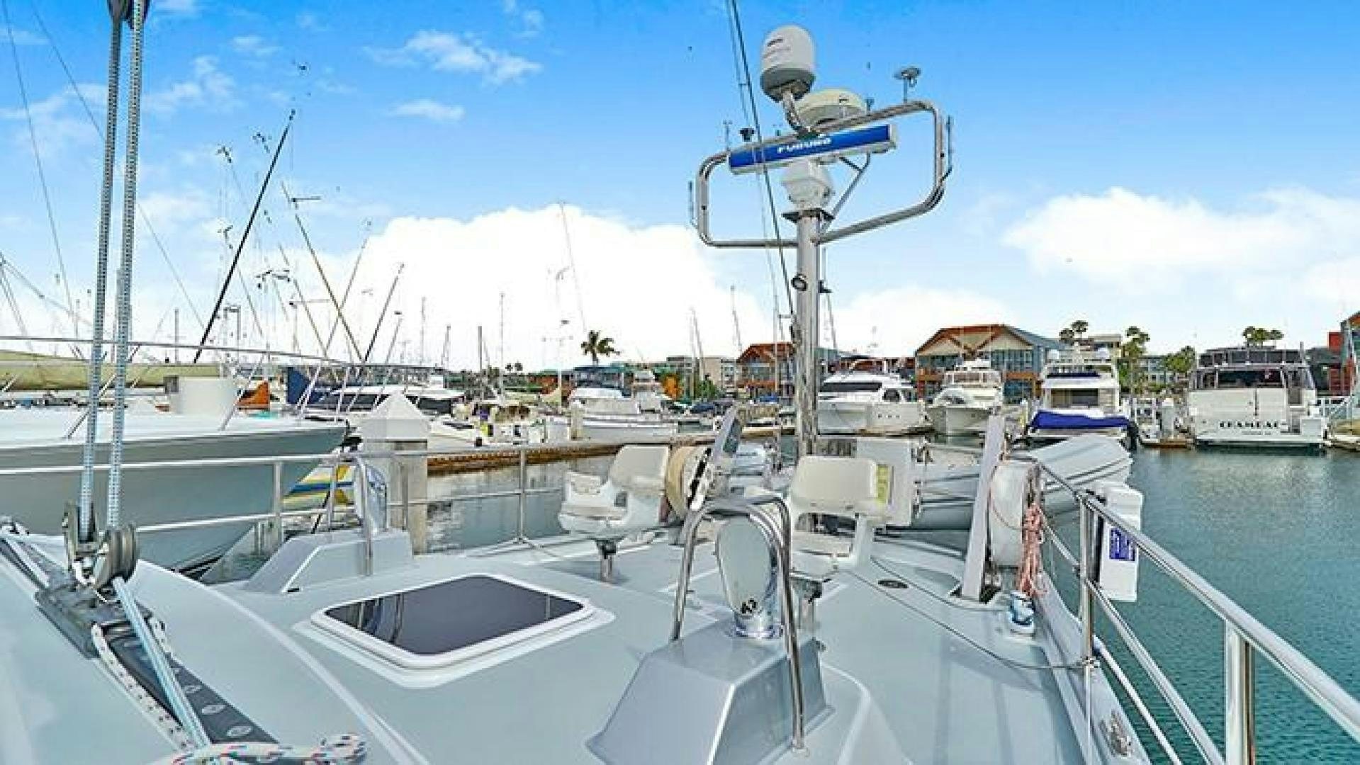 a boat docked at a pier aboard MAYA Yacht for Sale