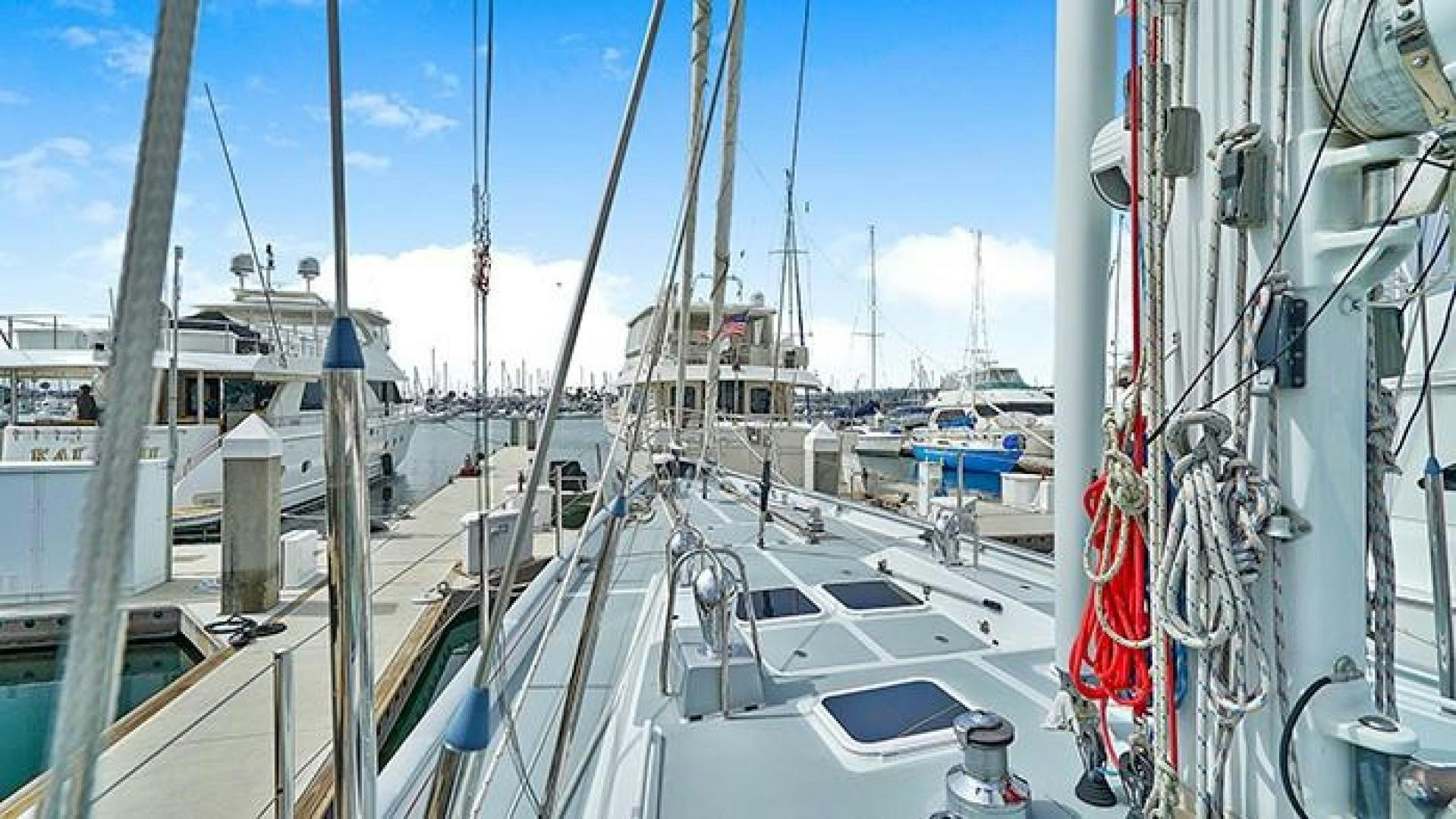 a boat docked at a pier aboard MAYA Yacht for Sale