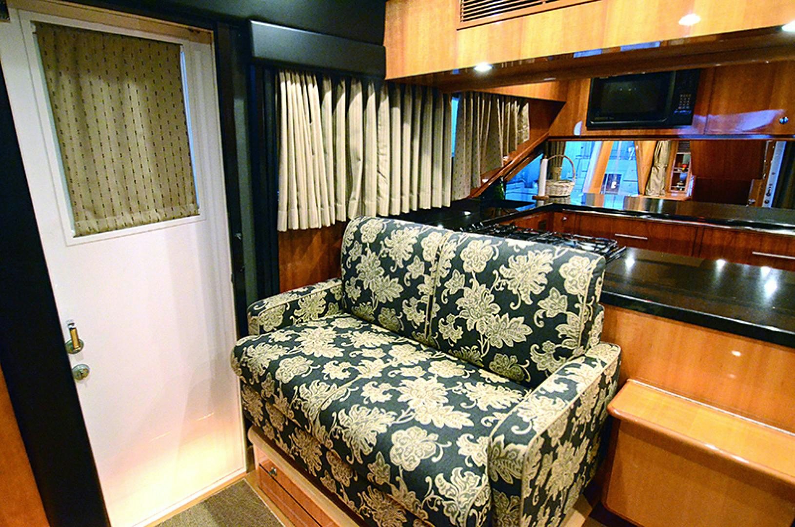 a room with a couch and a television aboard 4 PRINCESSES Yacht for Sale