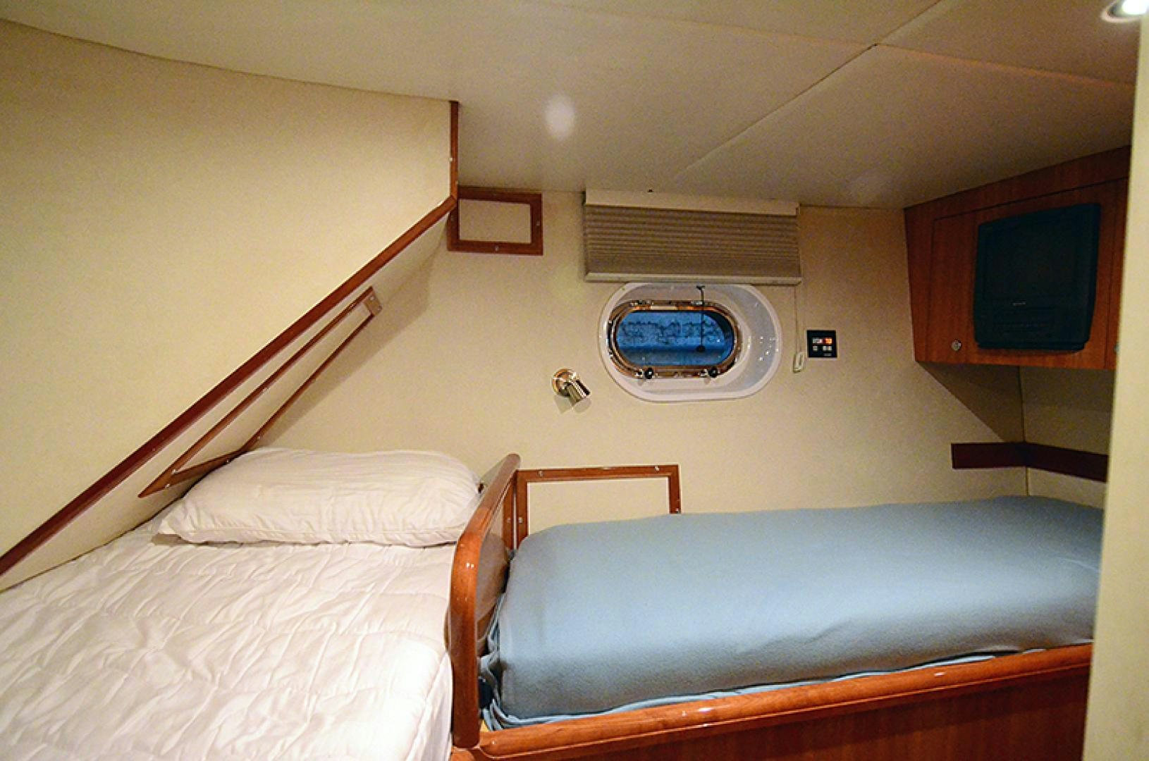 a room with two beds aboard 4 PRINCESSES Yacht for Sale
