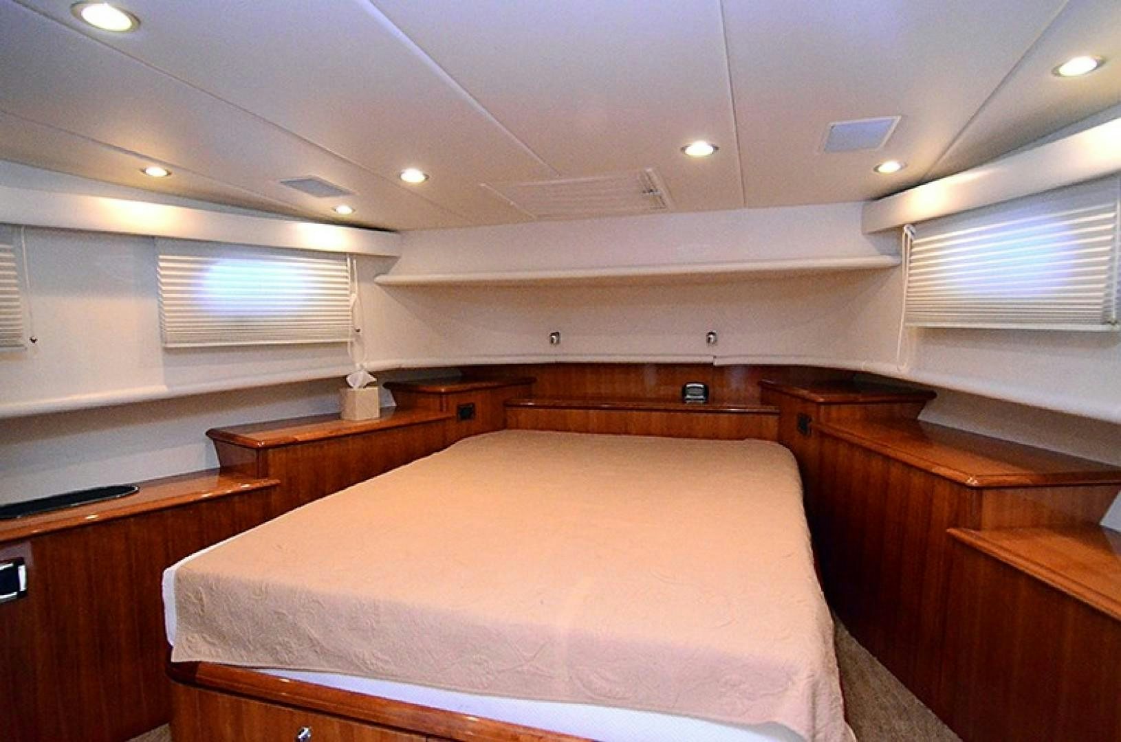 a room with a bed and a window aboard 4 PRINCESSES Yacht for Sale