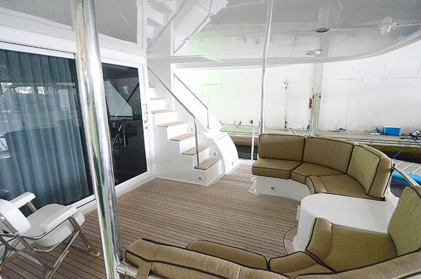 a room with a wood floor and a staircase aboard 4 PRINCESSES Yacht for Sale