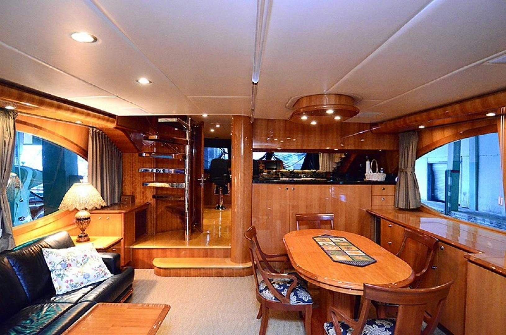 a living room with a dining table aboard 4 PRINCESSES Yacht for Sale