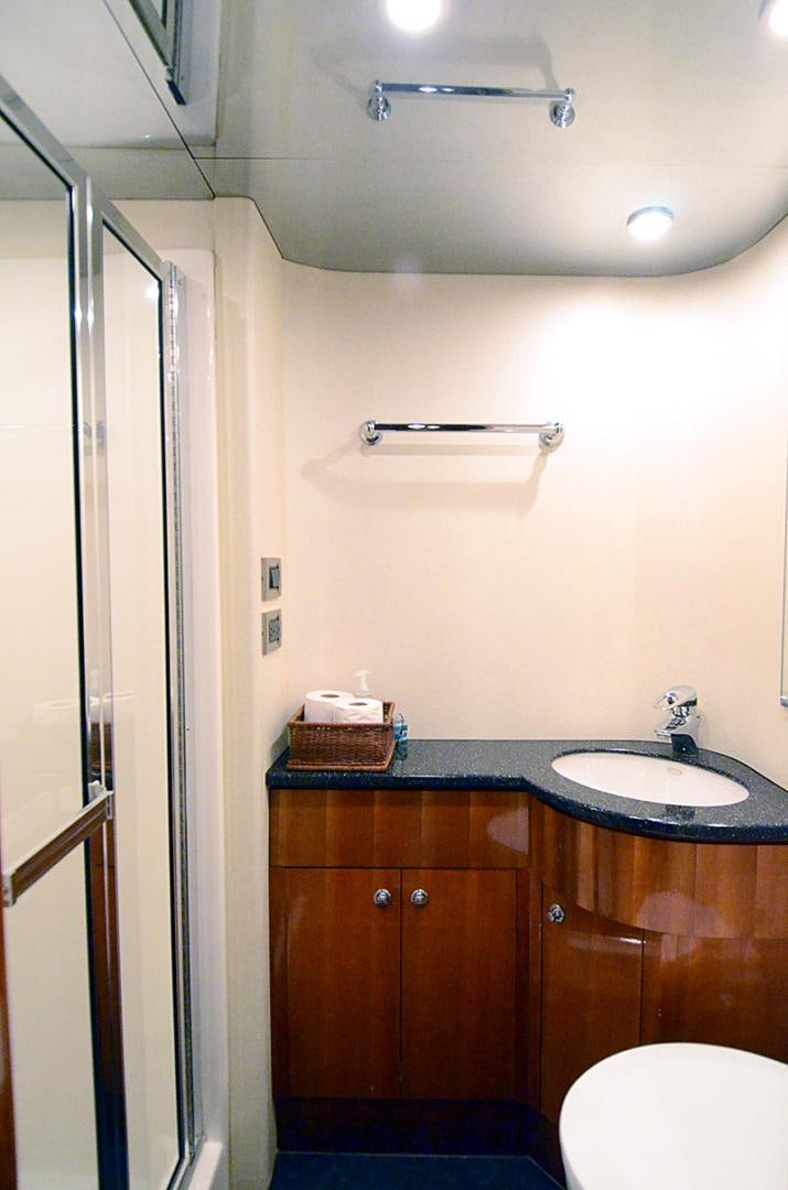 a bathroom with a sink and a toilet aboard 4 PRINCESSES Yacht for Sale