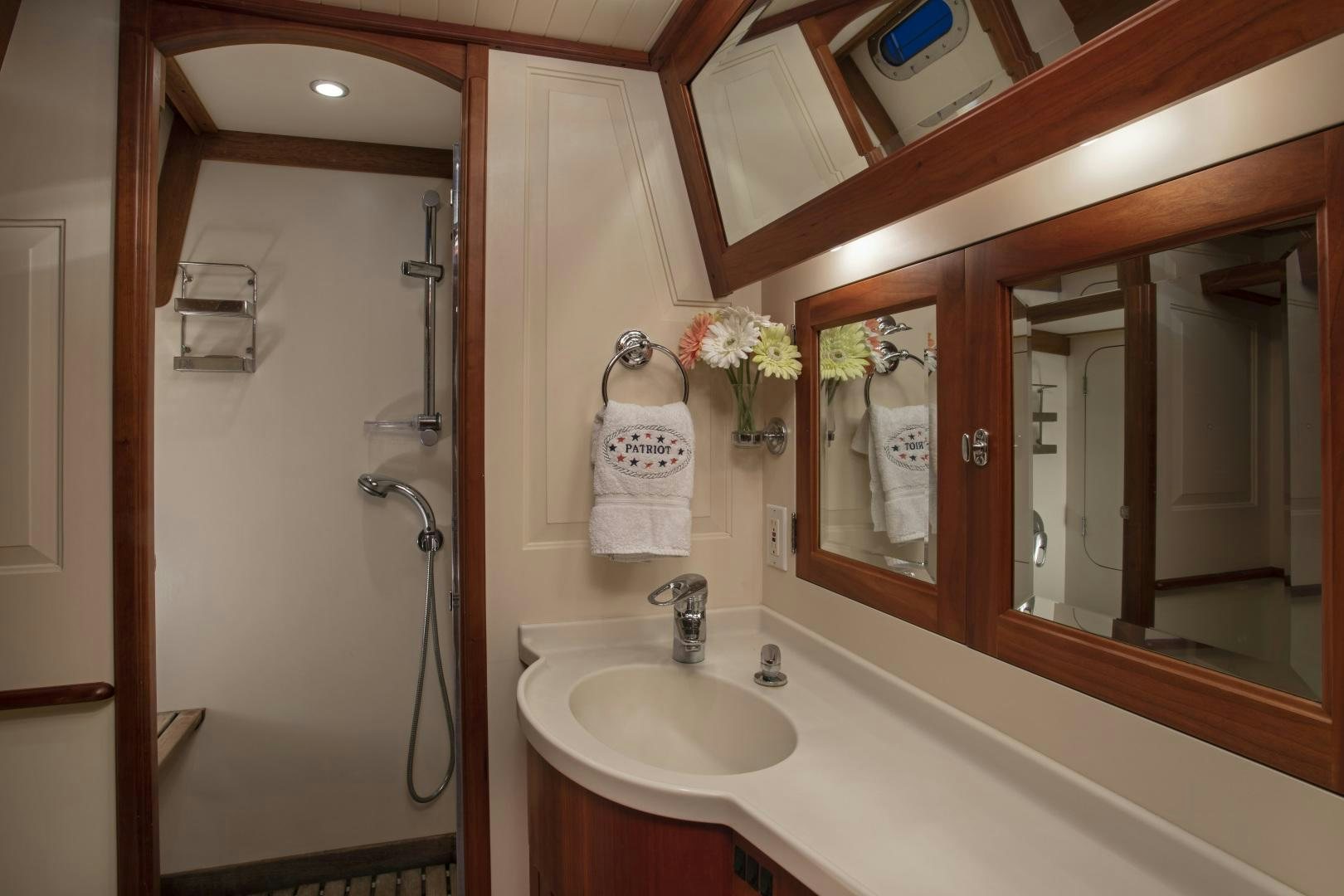 a bathroom with a sink and a mirror aboard PATRIOT  Yacht for Sale