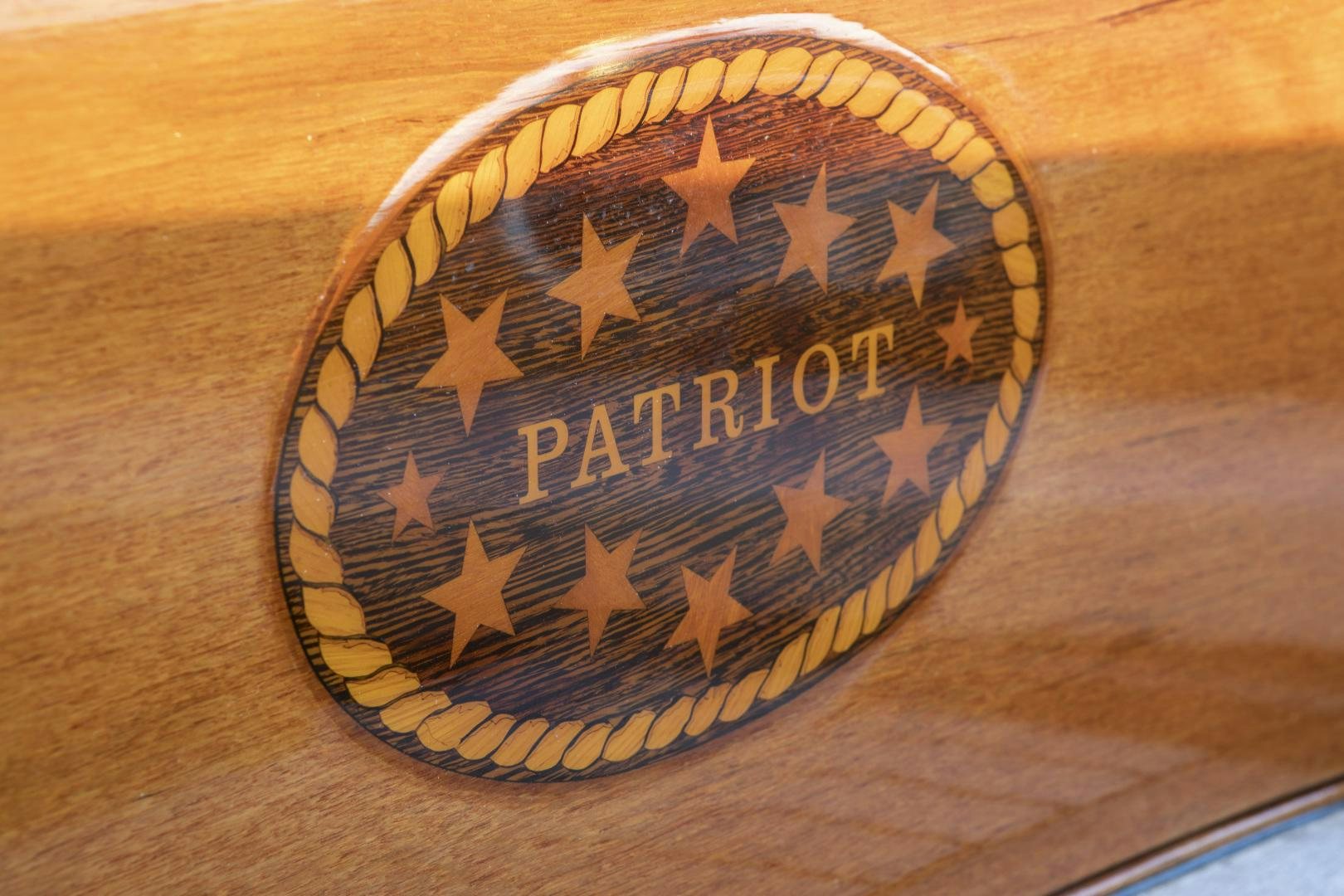 a gold and blue badge aboard PATRIOT  Yacht for Sale