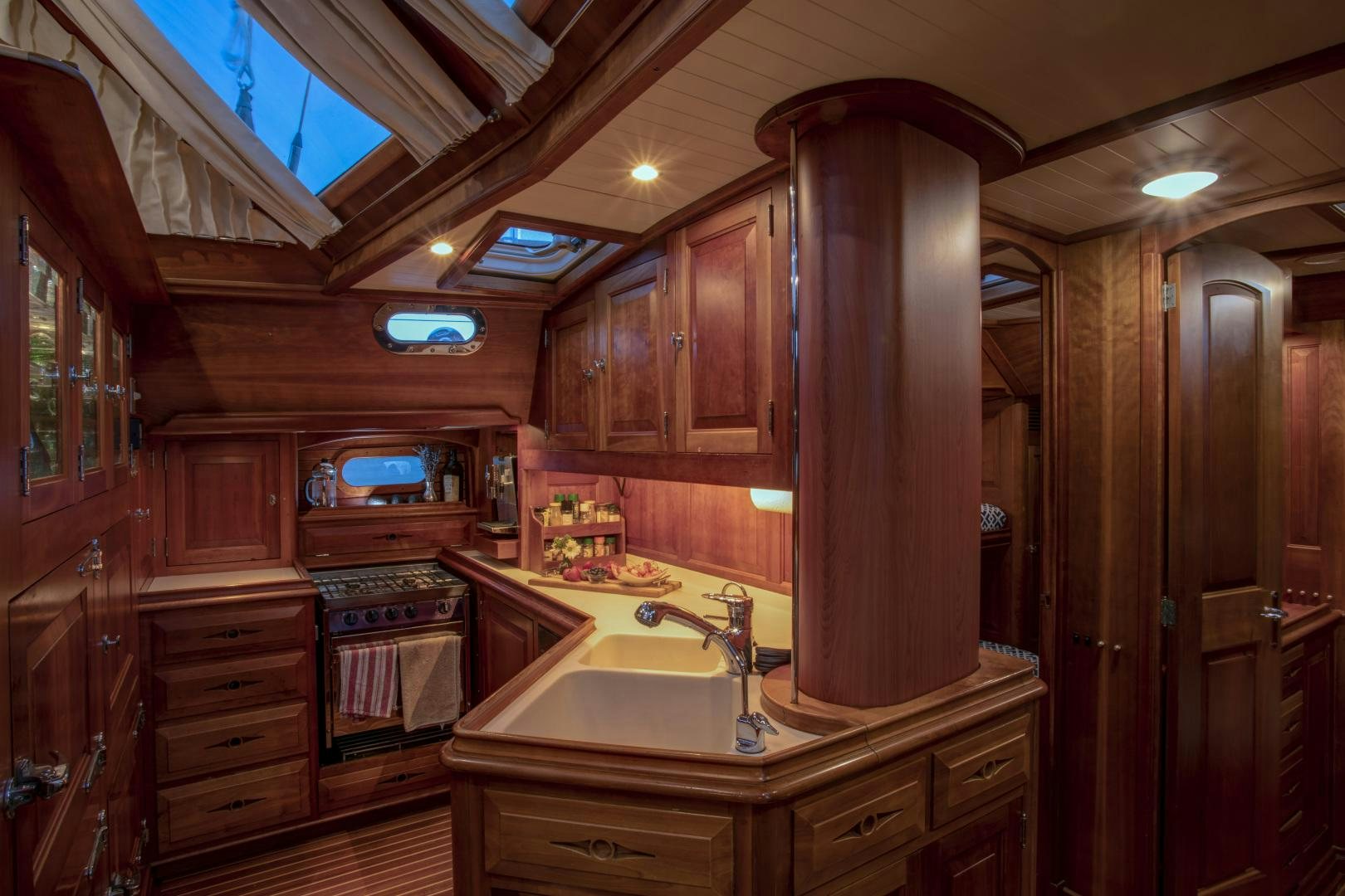 a kitchen with wooden cabinets aboard PATRIOT  Yacht for Sale