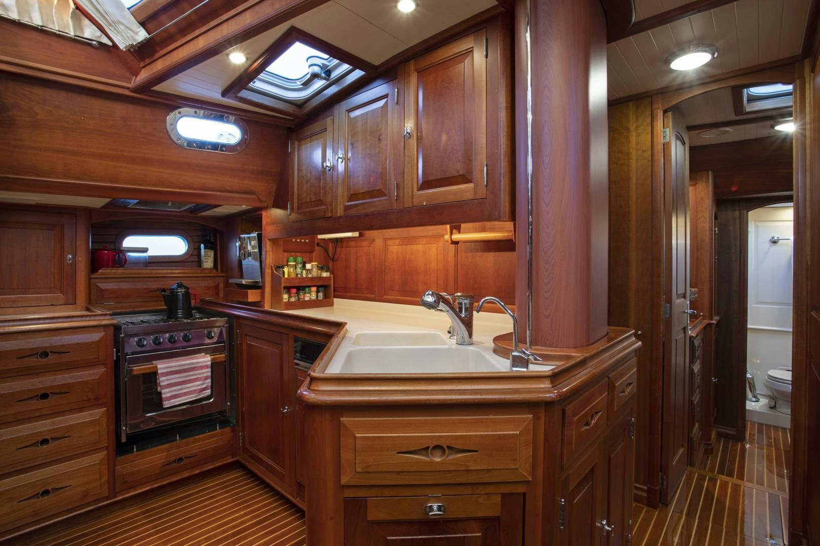 a kitchen with wooden cabinets aboard PATRIOT  Yacht for Sale