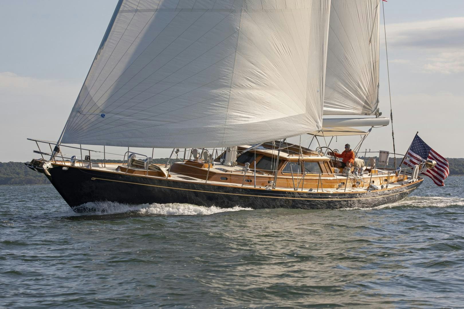 a boat with a flag on it aboard PATRIOT  Yacht for Sale