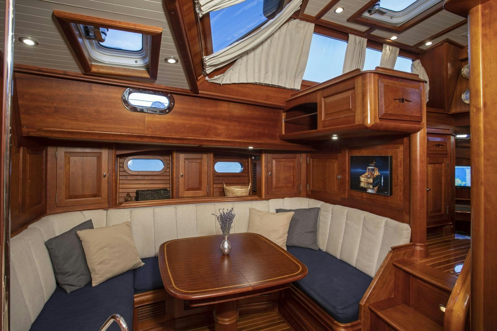 a room with a couch and a table aboard PATRIOT  Yacht for Sale