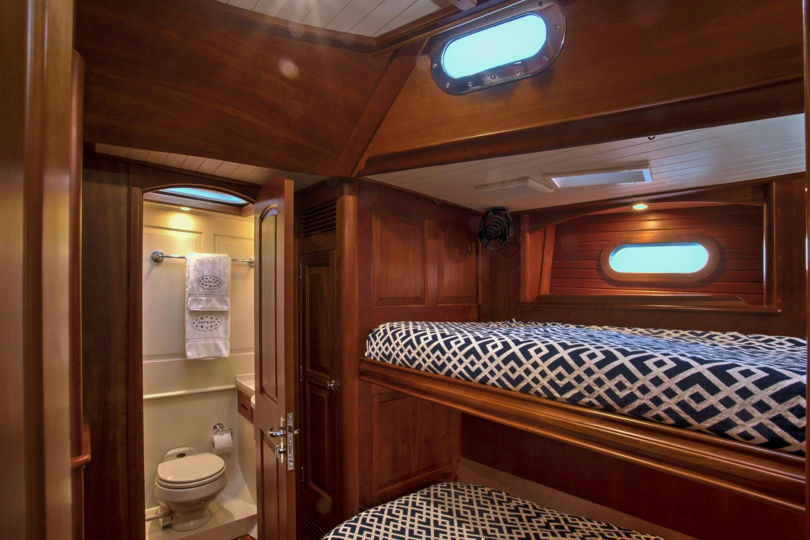a bathroom with a large bed aboard PATRIOT  Yacht for Sale