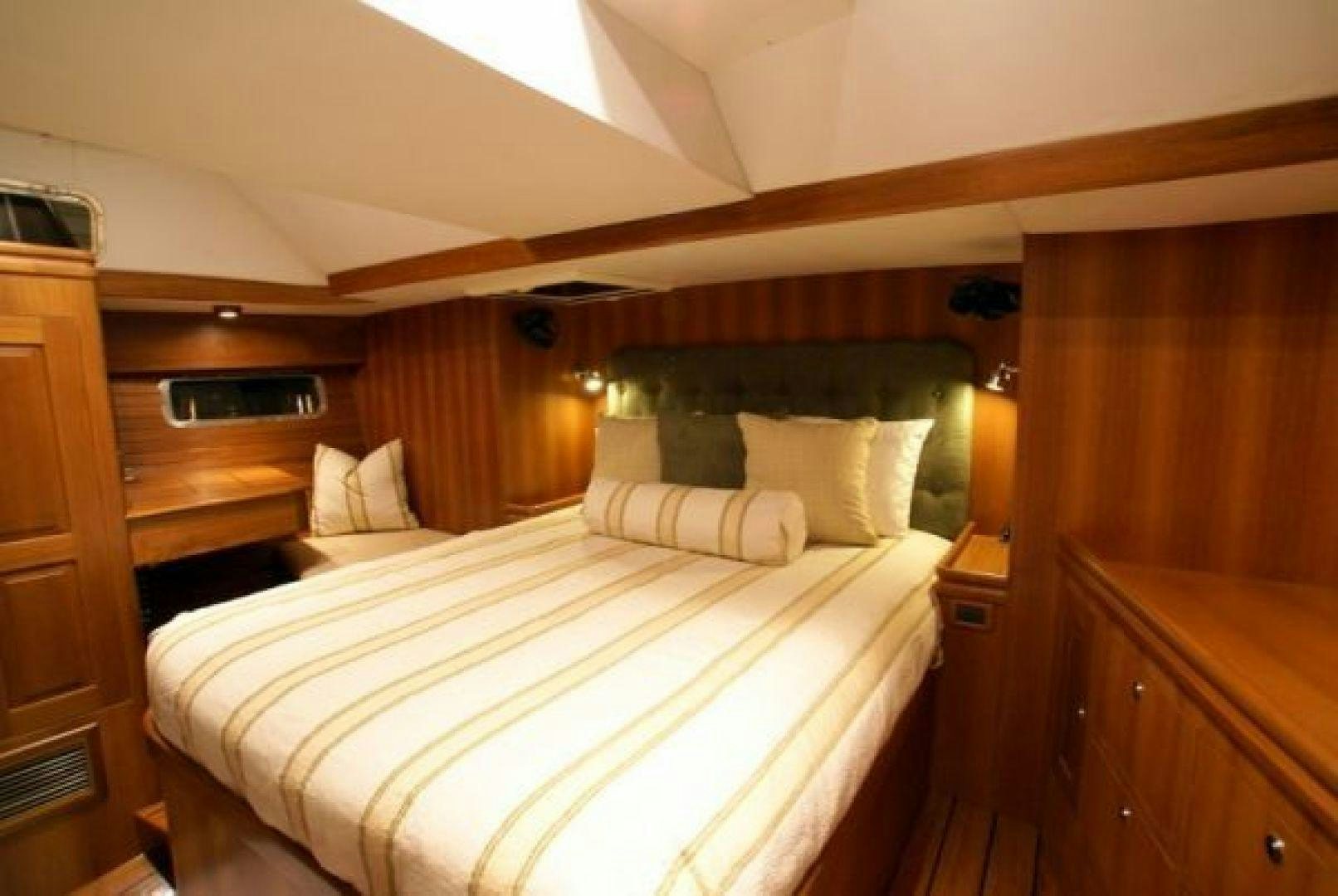 a bed in a room aboard amante Yacht for Sale
