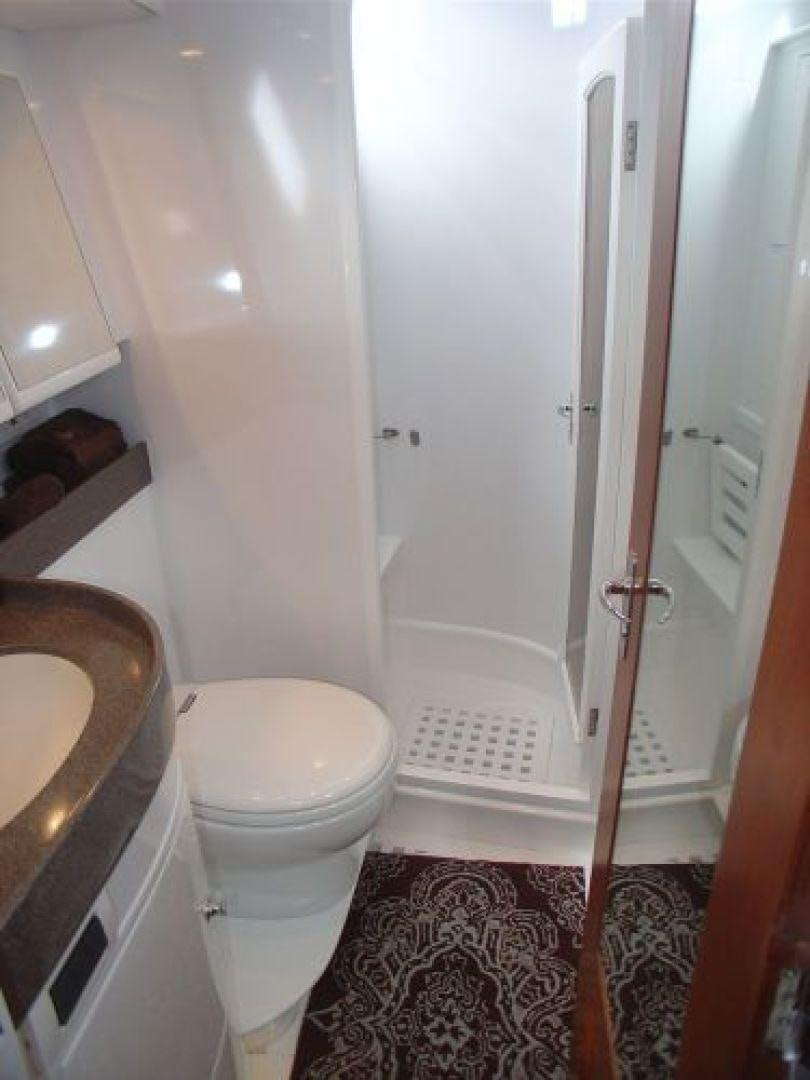 a bathroom with a toilet and sink aboard amante Yacht for Sale