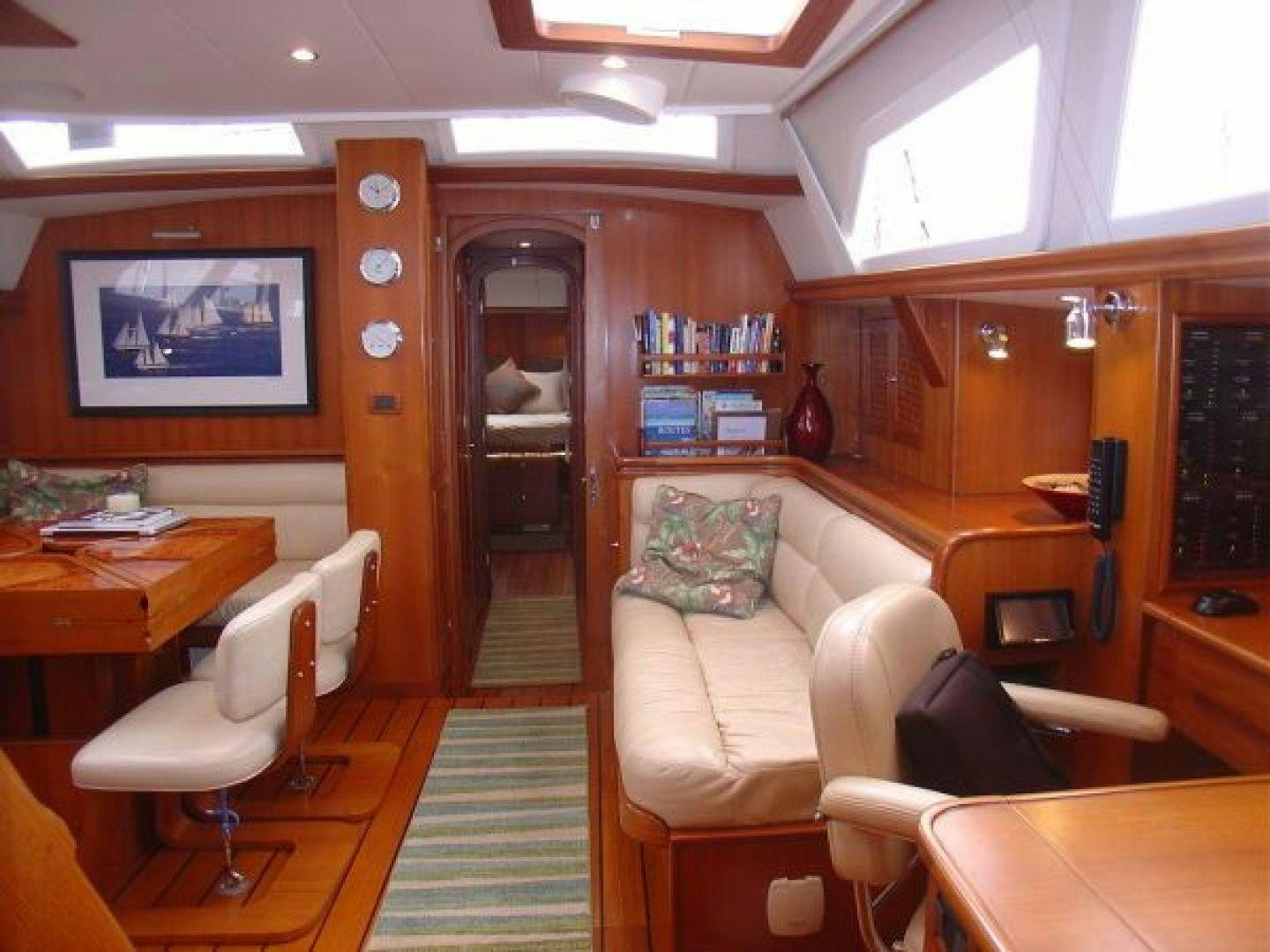 a living room with a couch and a table aboard amante Yacht for Sale