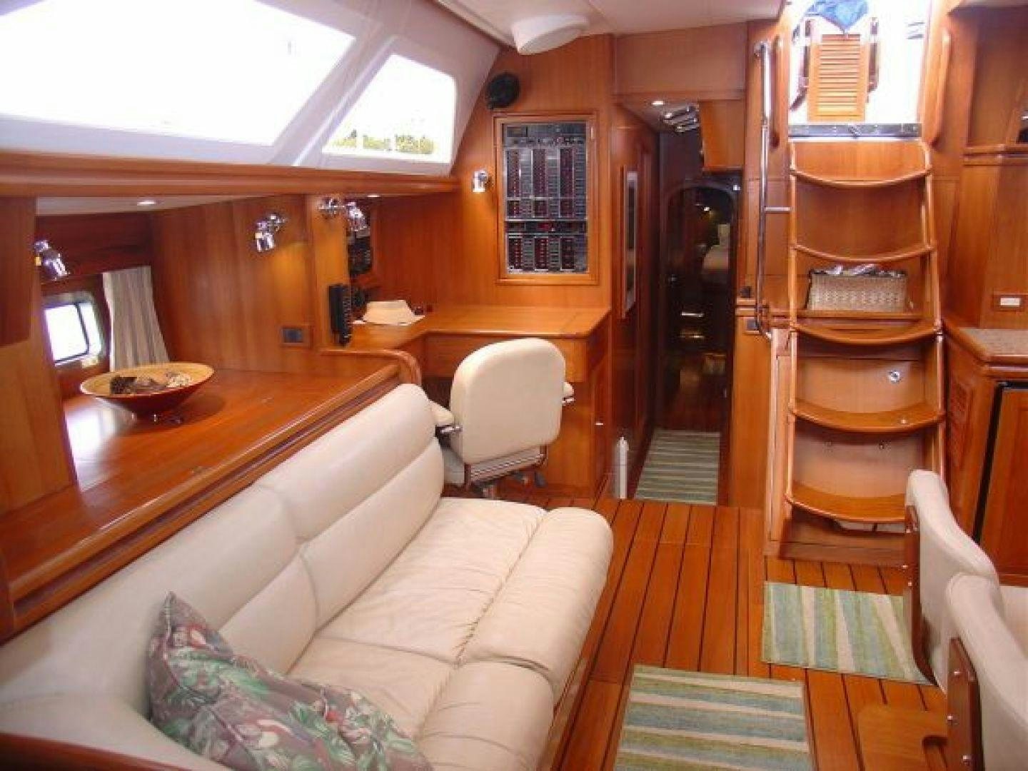 a living room with a couch and a table aboard amante Yacht for Sale