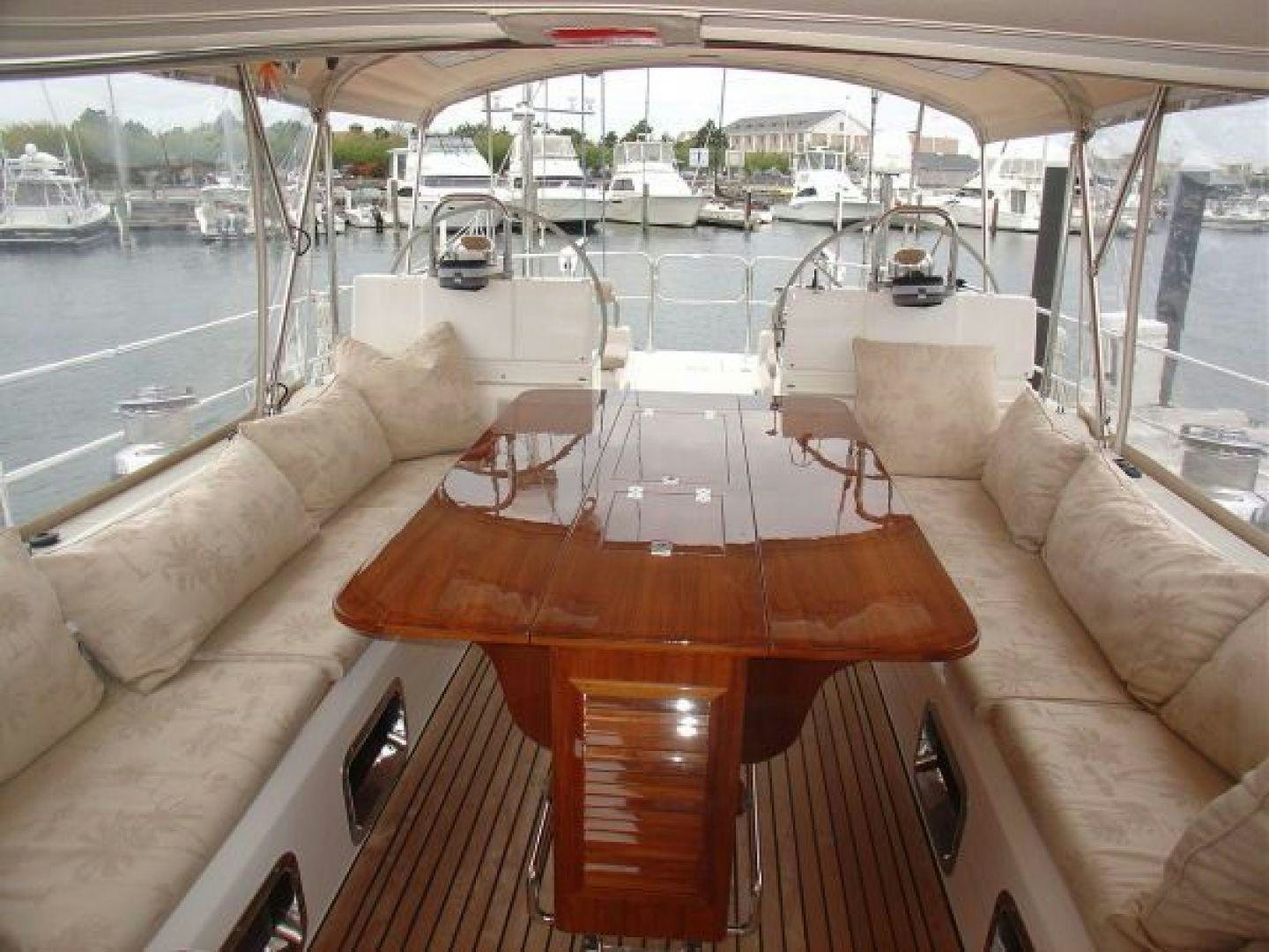 a table with chairs on it aboard amante Yacht for Sale
