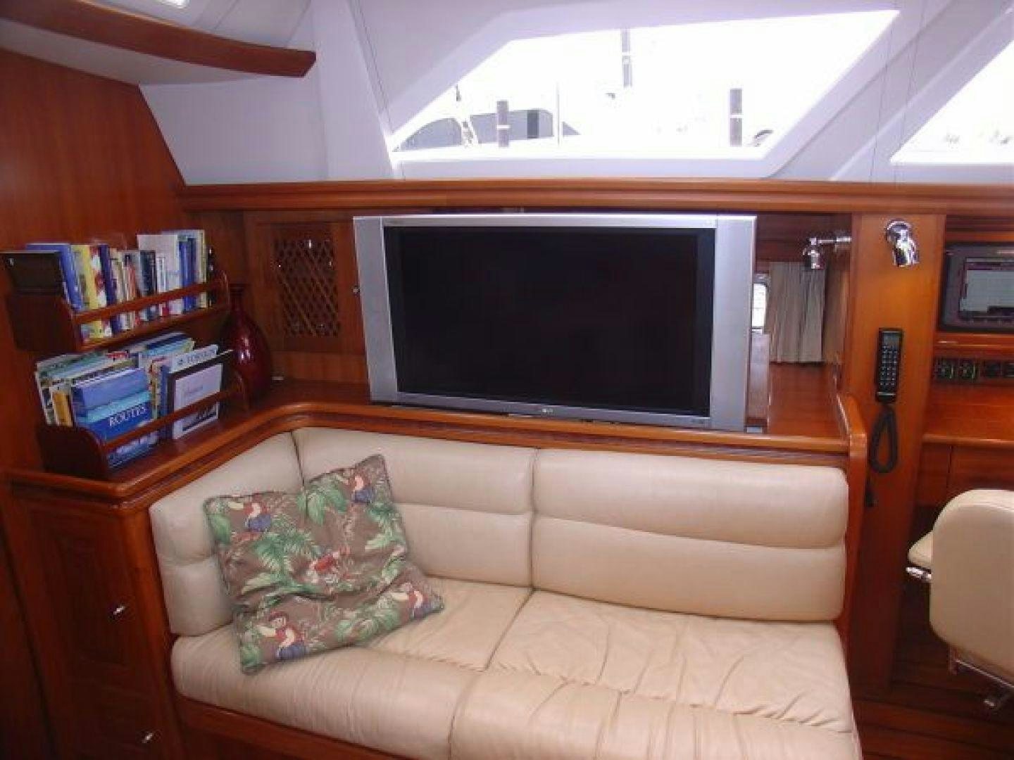 a living room with a couch and tv aboard amante Yacht for Sale