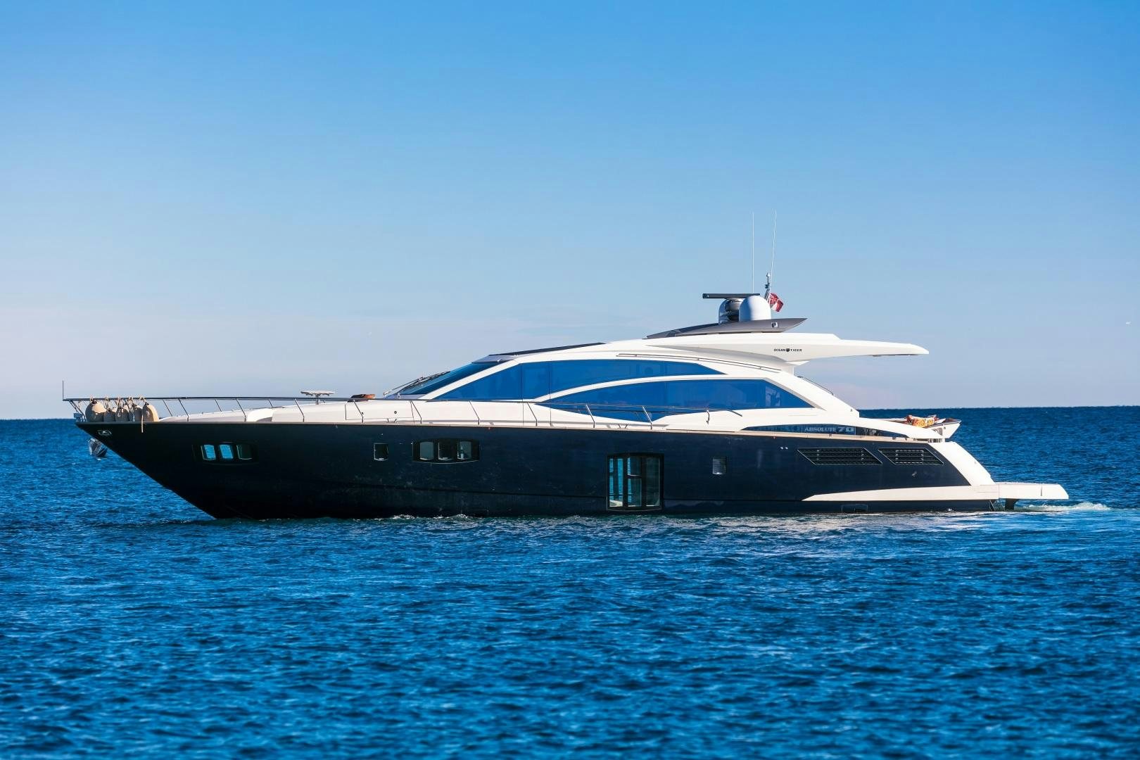 a large boat on the water aboard OCEAN TIGER Yacht for Sale