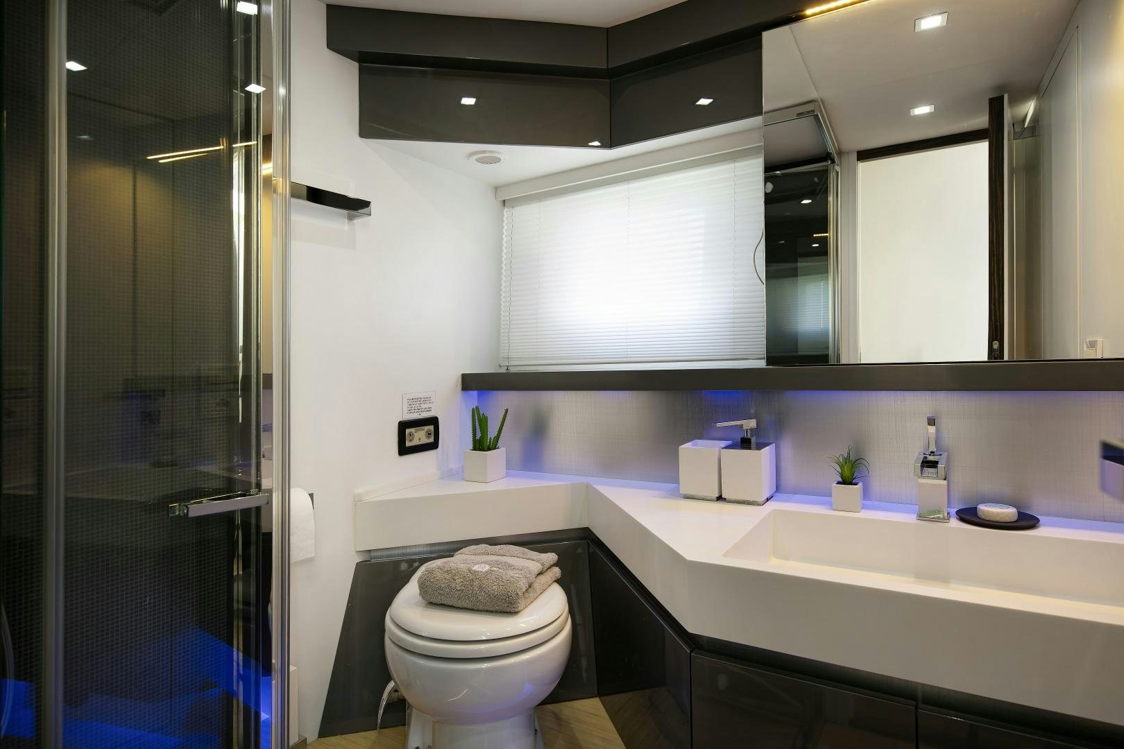 a bathroom with a glass shower aboard OCEAN TIGER Yacht for Sale