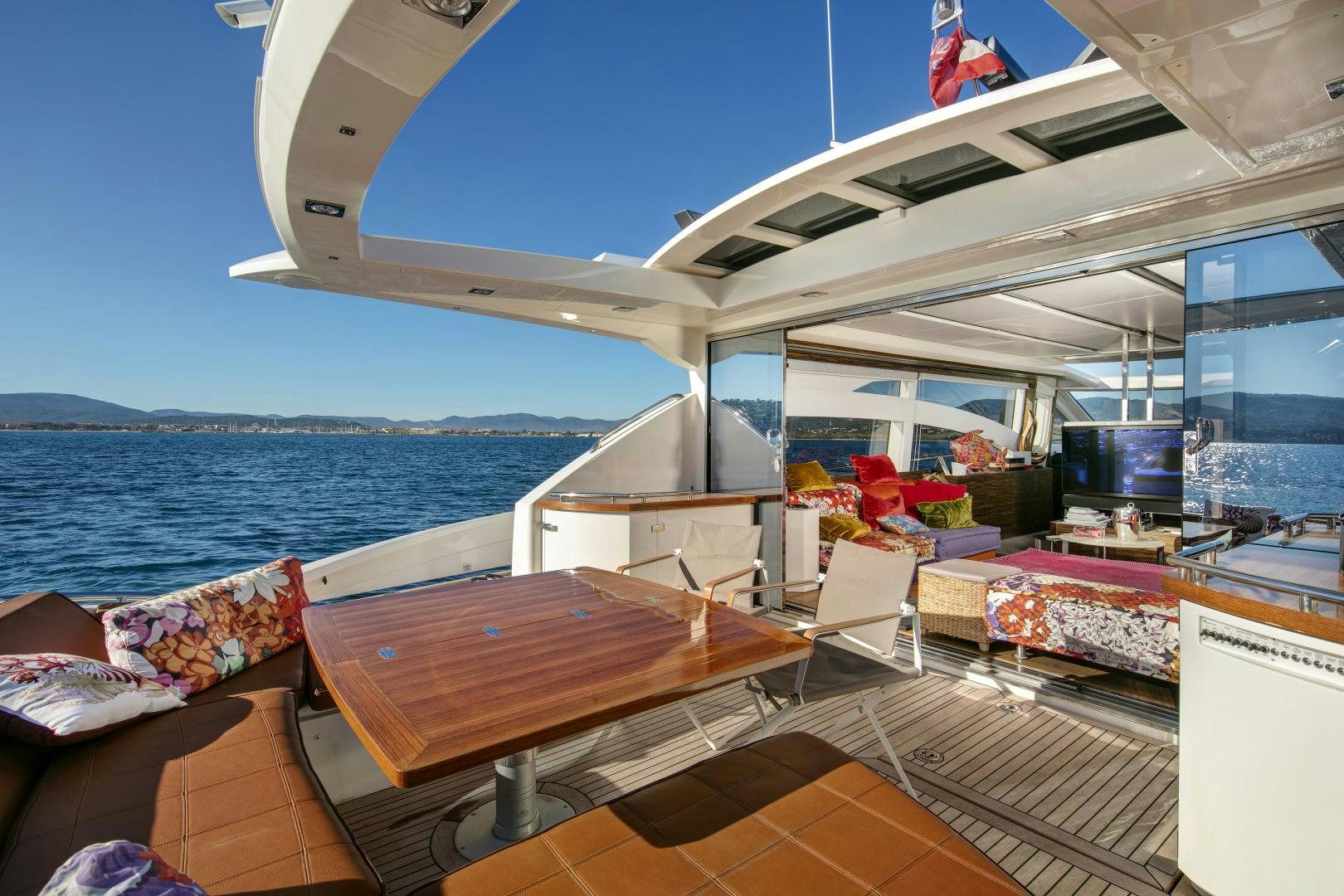 a room with a table and chairs aboard OCEAN TIGER Yacht for Sale