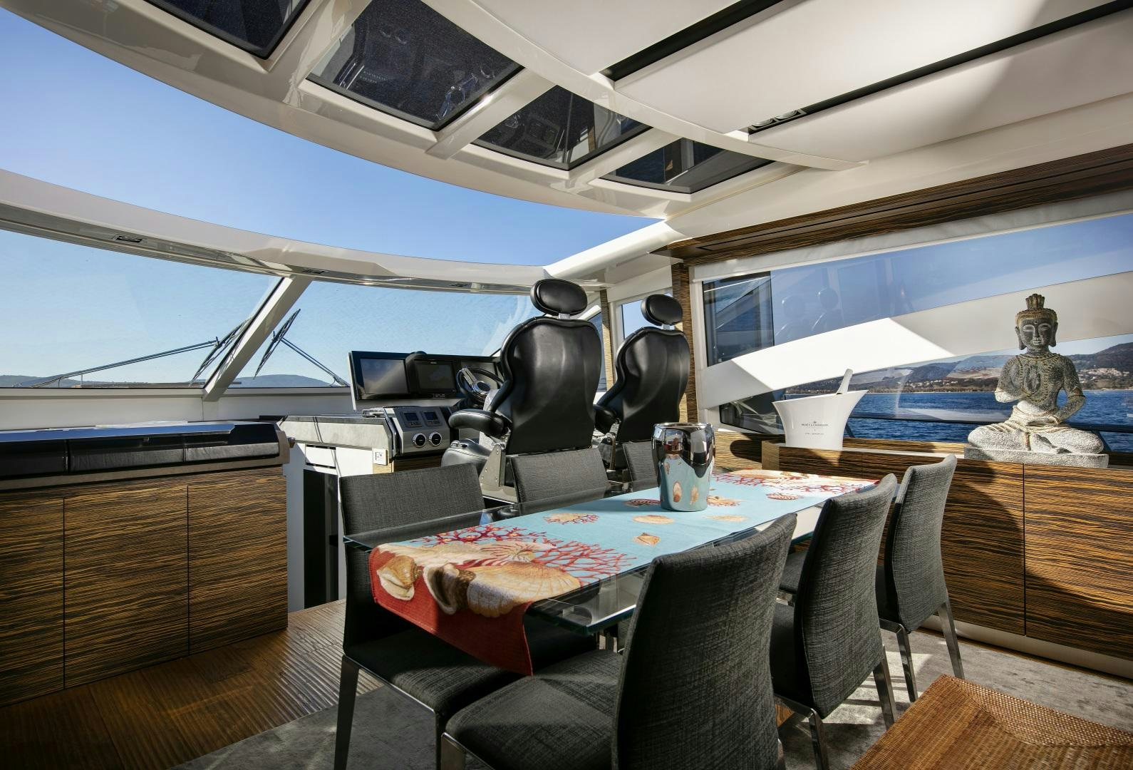 a room with a table and chairs aboard OCEAN TIGER Yacht for Sale