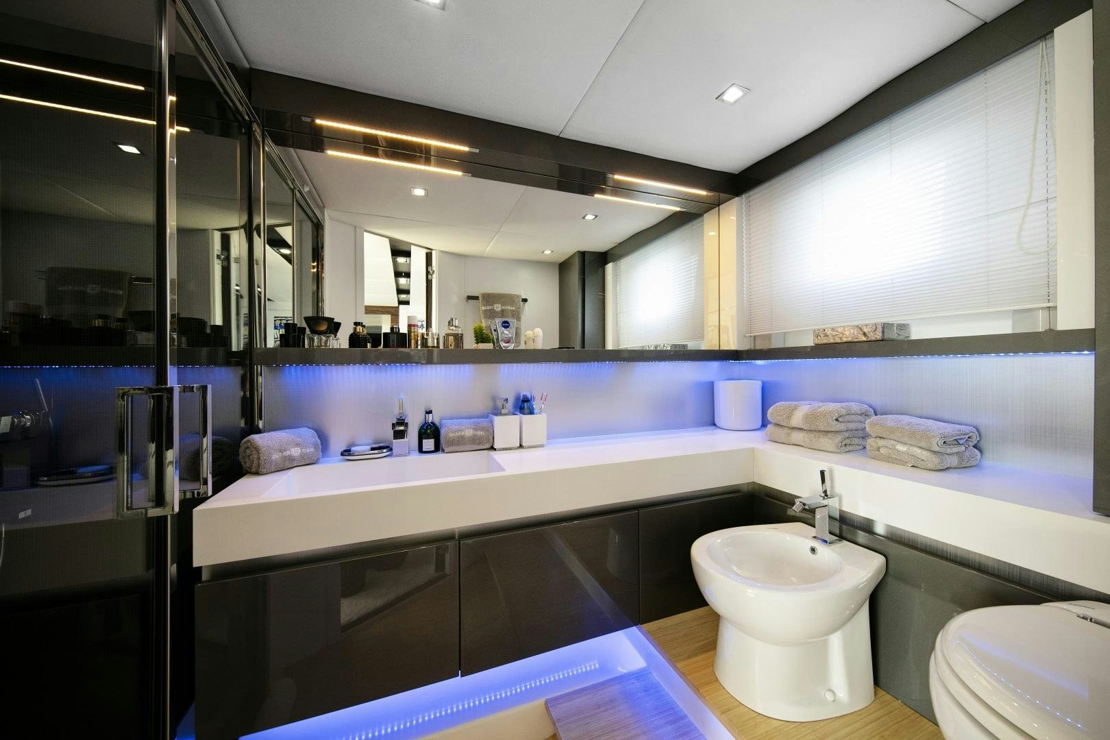 a bathroom with a large mirror aboard OCEAN TIGER Yacht for Sale