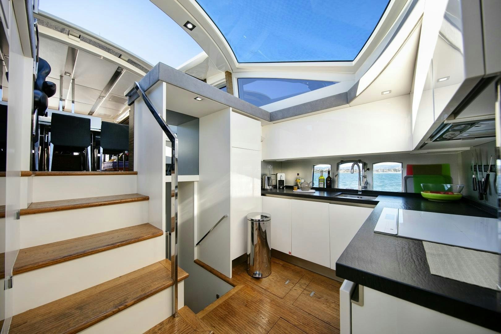 a kitchen with a staircase aboard OCEAN TIGER Yacht for Sale
