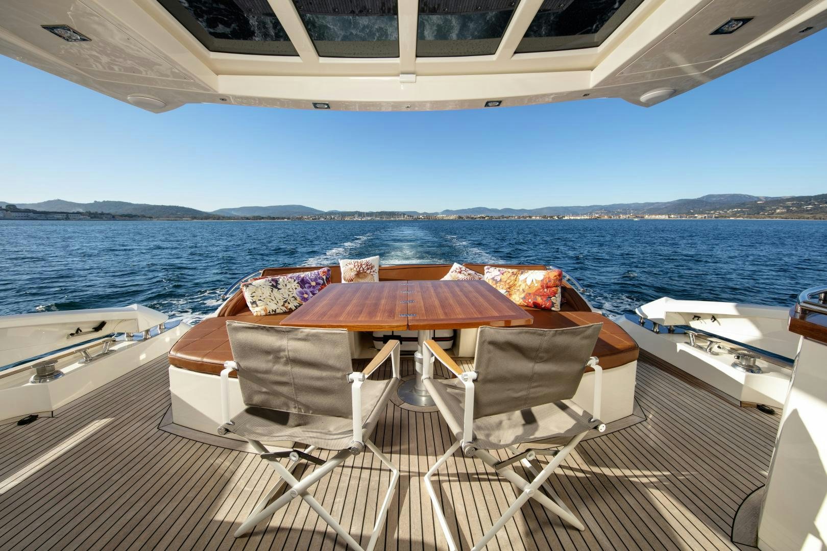a deck with chairs on it by the water aboard OCEAN TIGER Yacht for Sale