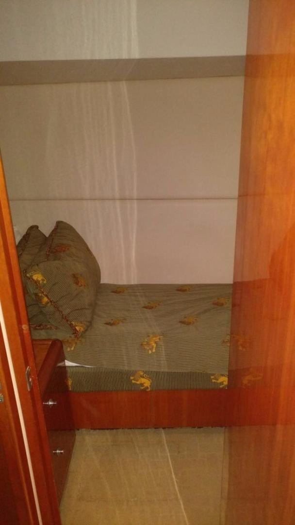 a bed with a pillow on it aboard SOLE RETREAT Yacht for Sale