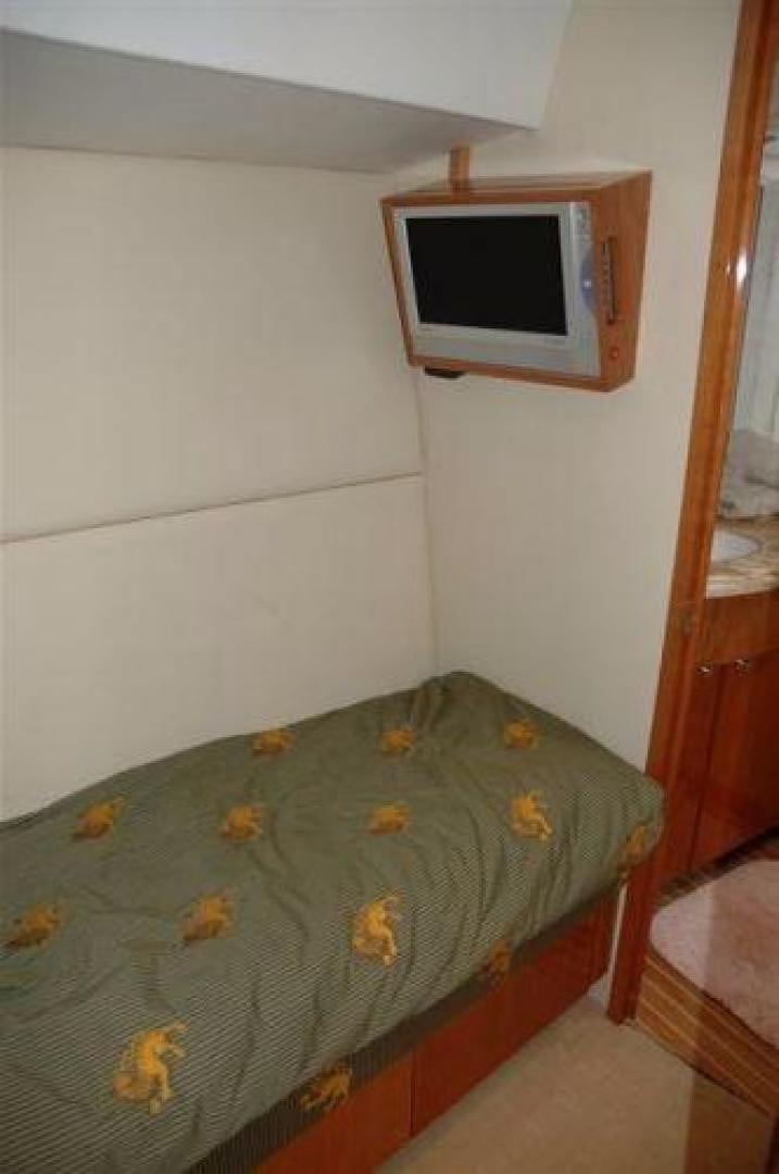 a small television on a wall aboard SOLE RETREAT Yacht for Sale