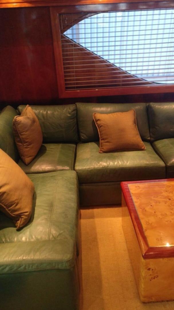 a couch with pillows aboard SOLE RETREAT Yacht for Sale