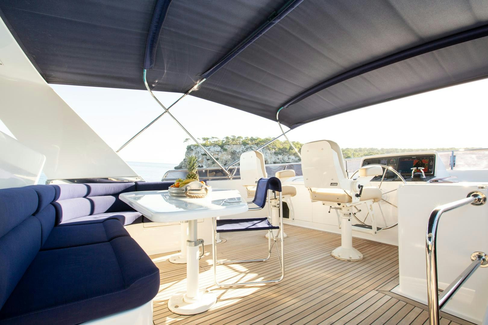 a tent with a table and chairs aboard MAXMARA Yacht for Sale