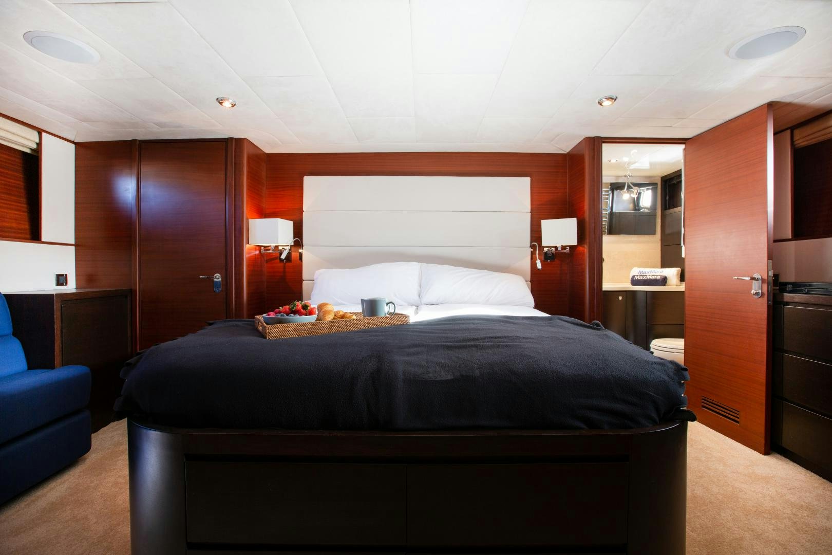 a bedroom with a bed and a desk aboard MAXMARA Yacht for Sale