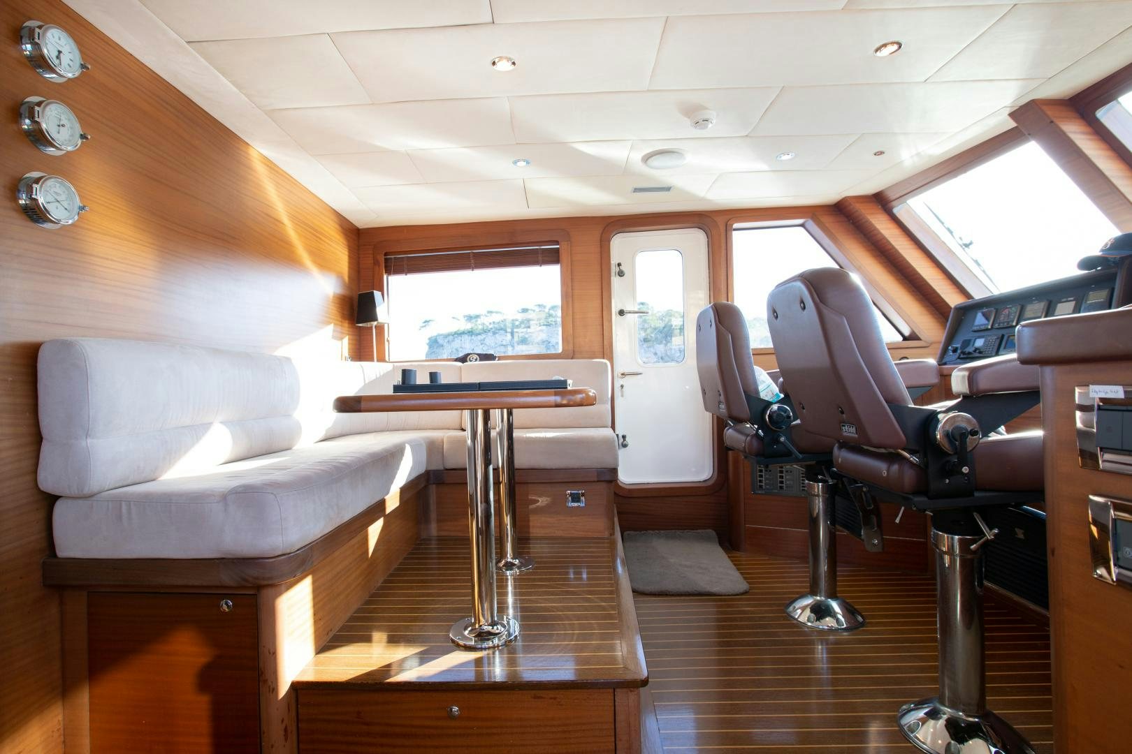 a room with a table and chairs aboard MAXMARA Yacht for Sale