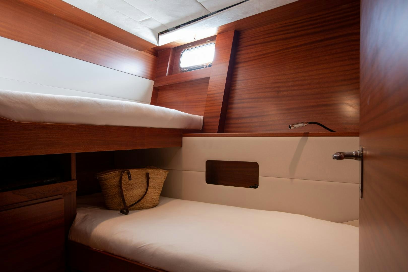 a bed with a basket on top aboard MAXMARA Yacht for Sale
