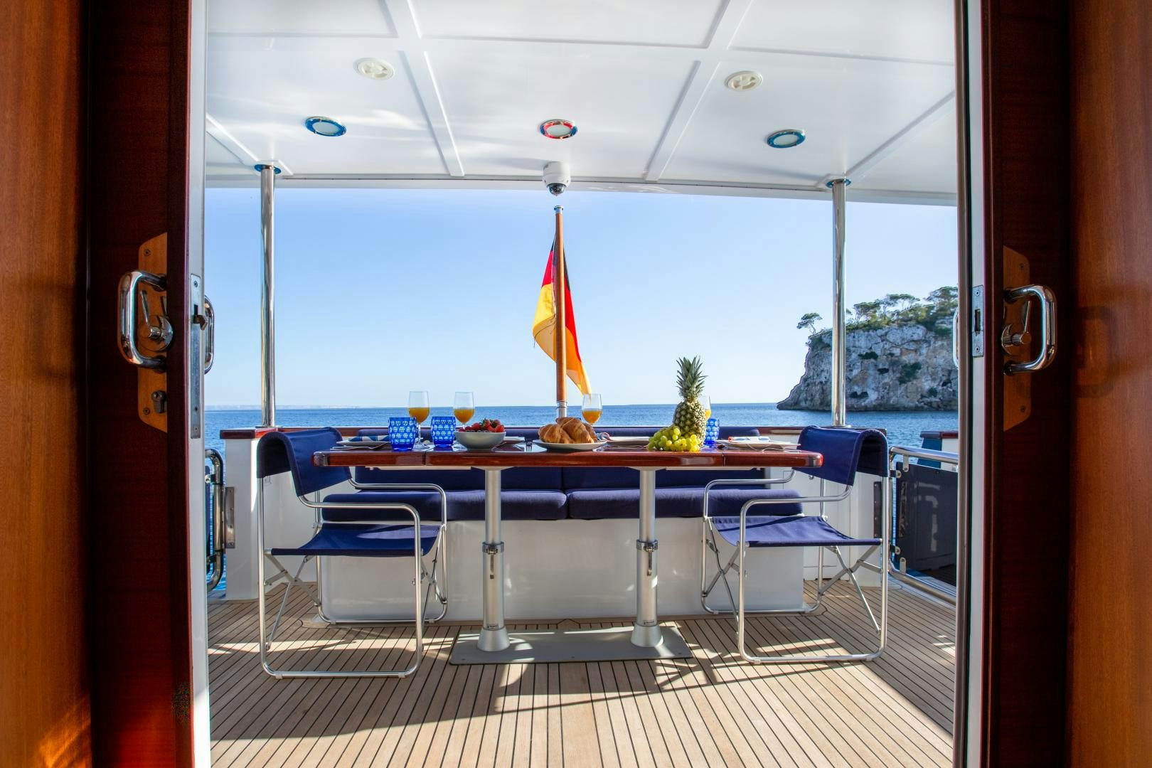 a table and chairs in a room aboard MAXMARA Yacht for Sale