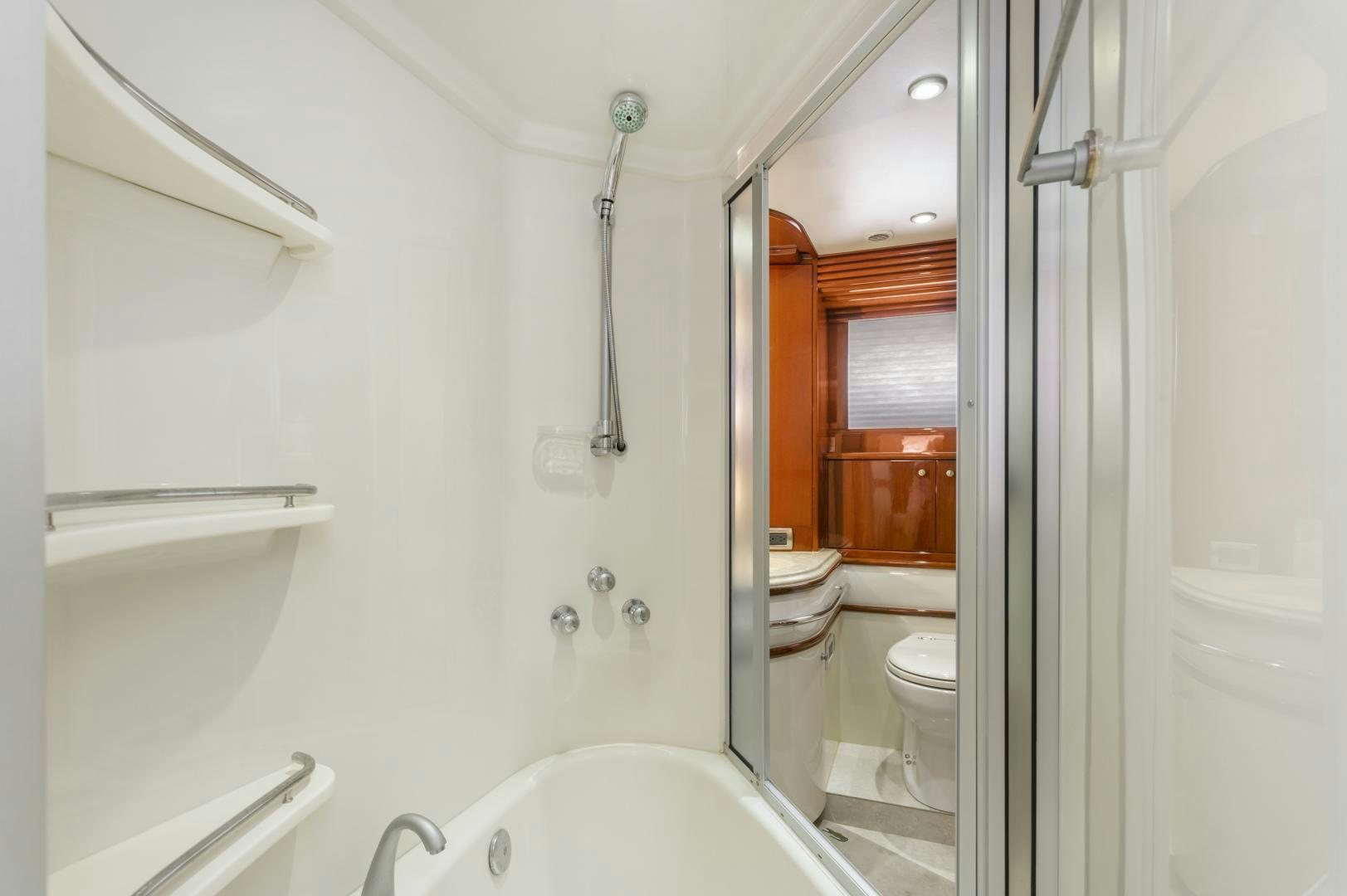 a bathroom with a tub sink and toilet aboard MONDRIAN Yacht for Sale