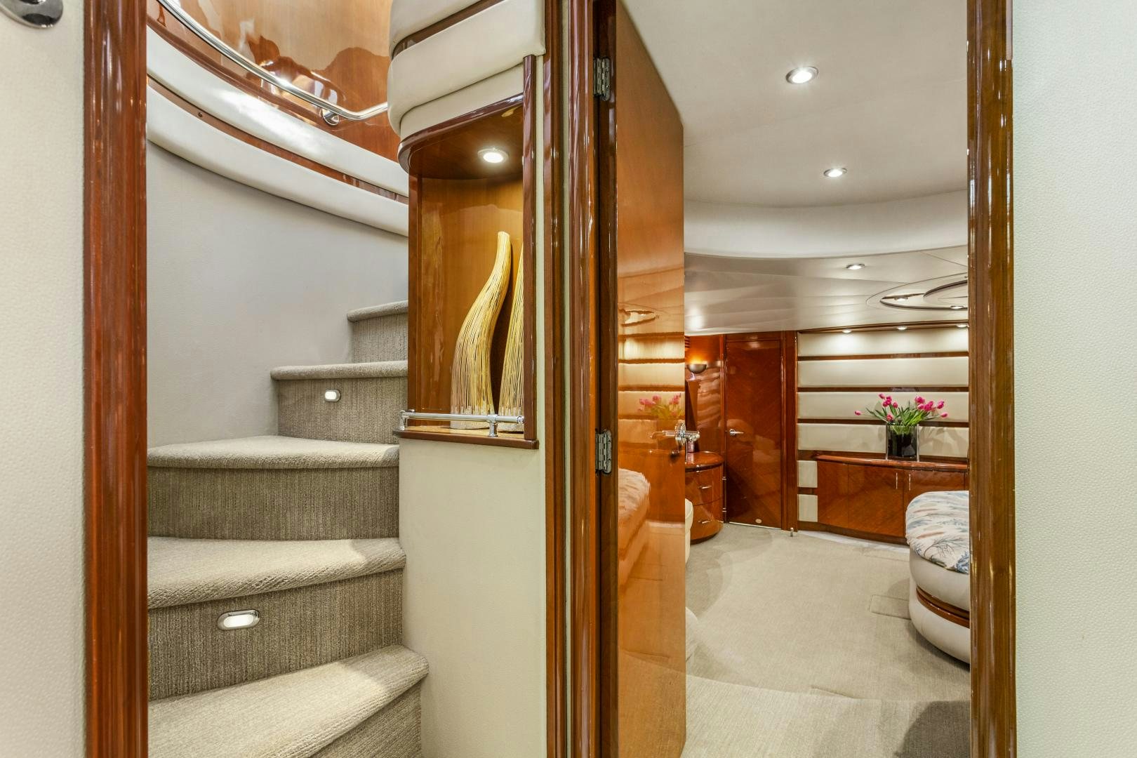 a bathroom with a wood door aboard MONDRIAN Yacht for Sale