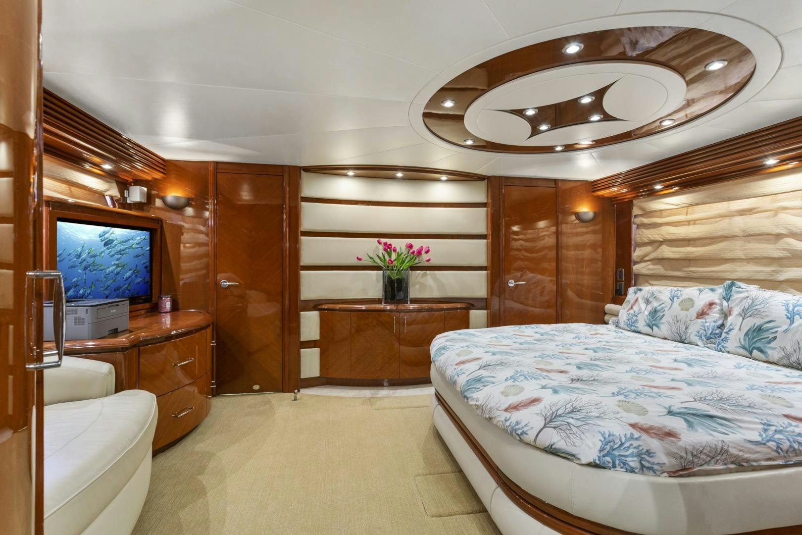 a bedroom with a bed and a tv aboard MONDRIAN Yacht for Sale