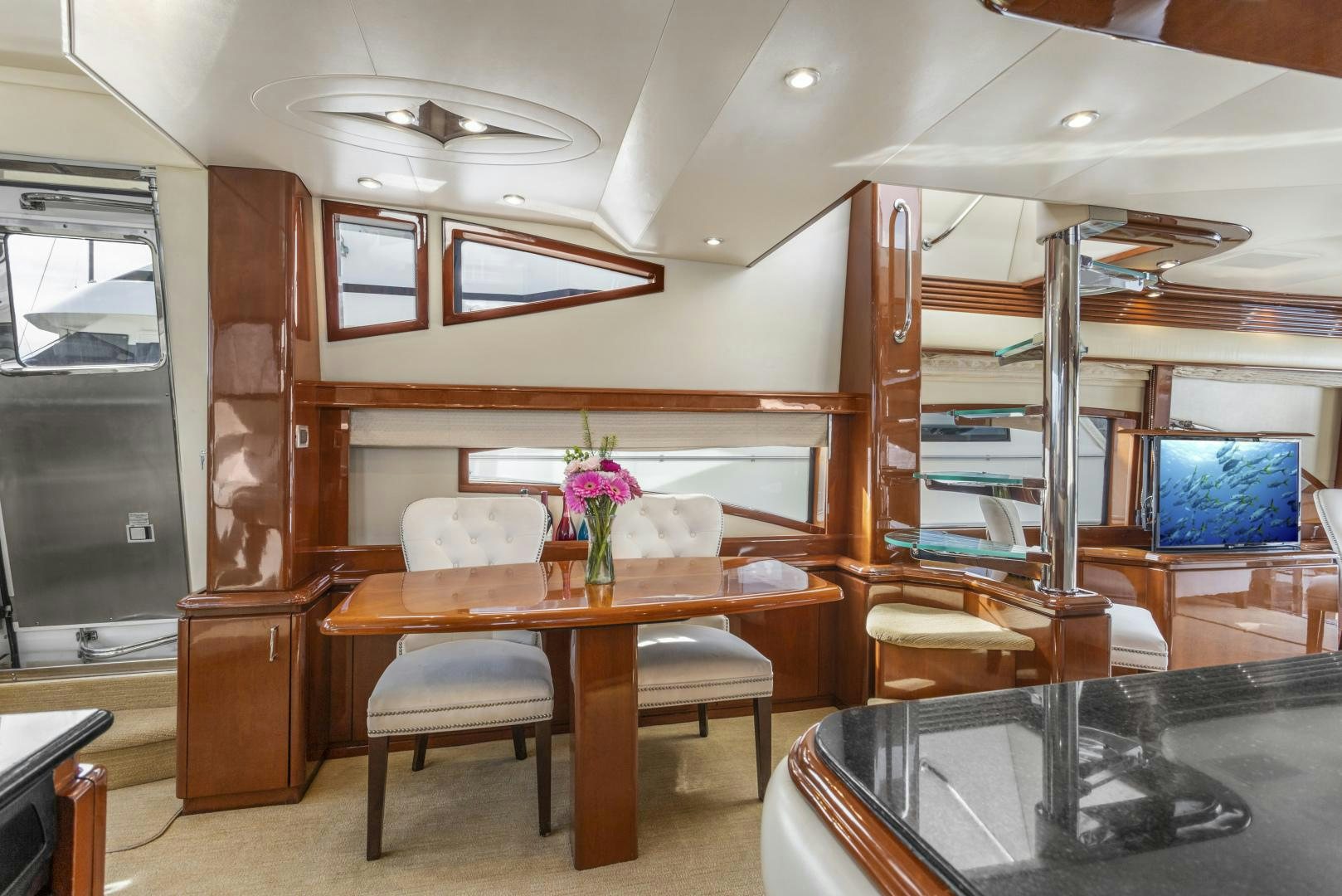 a room with a table and chairs aboard MONDRIAN Yacht for Sale